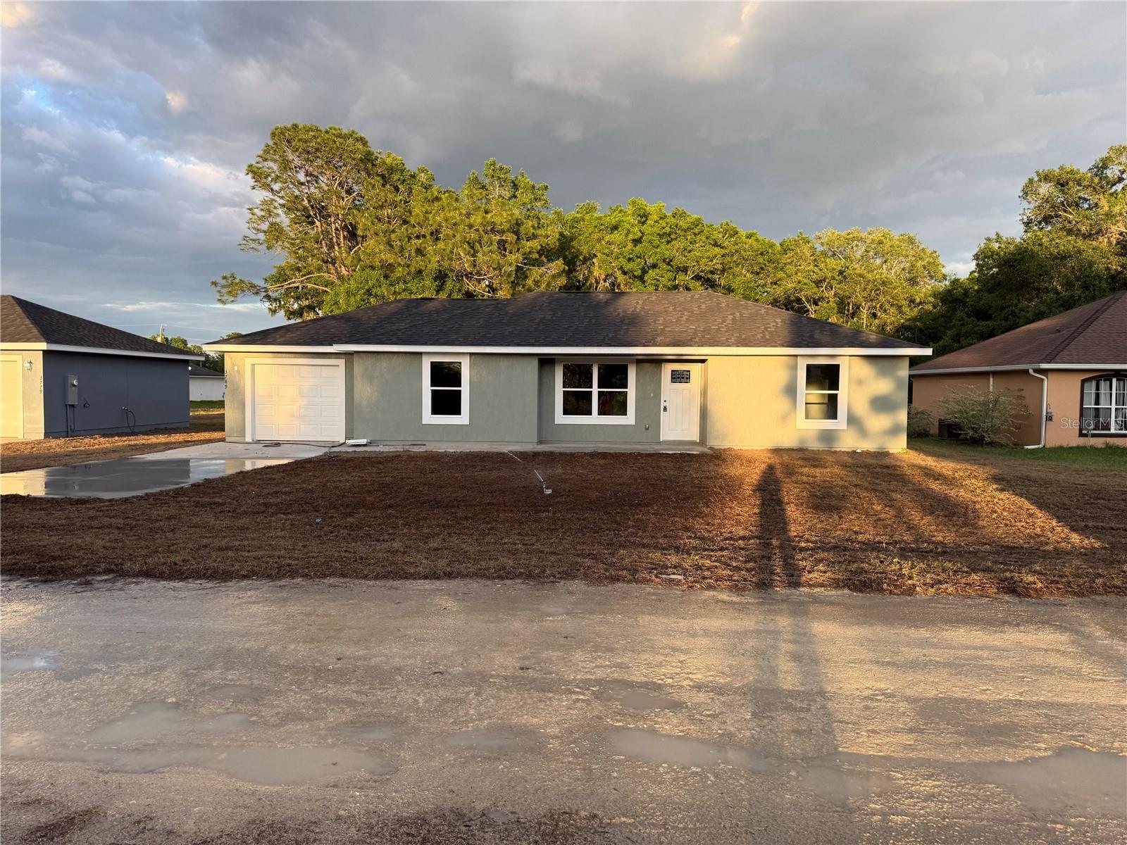 Brand new spacious Stucco exterior frame home at an affordable price! Split plan three bedroom / two bathroom with attached finished one car garage that is equipped with a garage door opener. The kitchen offers Granite counter tops with upgraded cabinets. Stainless steel appliance package which includes the range, microwave, dishwasher and refrigerator. Tile in the bathrooms, Ceiling fans and more. Great location to shopping, activities, medical facilities and restaurants. If your looking for a HOME or INVESTMENT this one is for you.