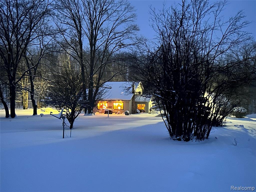 Nestled in the heart of northern Michigan’s natural beauty, this stunning property at **7727 Bald Hill Rd, Lovells Township**, just outside of Grayling, offers the perfect blend of comfort, privacy, and outdoor adventure. Set on 19.57 acres of serene woodland, this four-bedroom, two-bath home is ideal for those seeking a peaceful retreat surrounded by wildlife and nature. This well-maintained home welcomes you with a spacious open-concept layout. The kitchen flows seamlessly into a large living room featuring a cozy pellet wood-burning stove, perfect for chilly Michigan evenings. The **main floor** includes two comfortable bedrooms, a full bath, and a convenient first-floor laundry room. Upstairs, the loft area overlooks the living room and includes two additional bedrooms and a full bath, perfect for guests or family. The home’s radiant hot water heating system* installed in 2015, provides efficient and instant warmth throughout the seasons. Step outside to experience the property’s true charm. The **enclosed porch** offers panoramic views of the surrounding woods, where you can regularly spot deer, turkey, and even the occasional black bear. The land includes a deer blind, ready for hunting enthusiasts, and is just a 15-minute walk to the Au Sable River, perfect for fishing, kayaking, or quiet reflection. In winter, nearby snowmobile trails make this a year-round recreational haven. Additional features include a massive barn capable of housing 4+ vehicles, conveniently located off the circular driveway, a new Generac backup generator installed in 2024, and **well spring water** providing crisp, clean drinking water. The home is being offered partially furnished, and the sale includes a zero-turn Bad Boy mower with a 50-inch deck. 7727 Bald Hill Rd offers a rare opportunity to own a beautifully kept home on nearly 20 acres of northern Michigan wilderness.  BATVAI