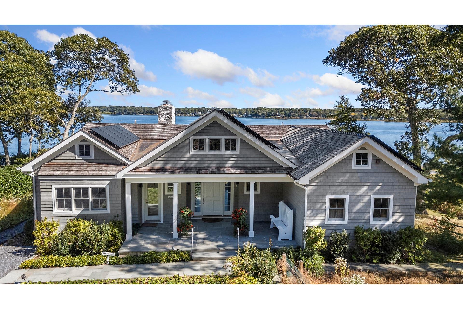 Facing due east with panoramic views and brilliant sunrises with 101' water frontage on Three Mile Harbor, this traditional house was thoroughly renovated in 2022. The upside-down configuration is approximately 3,500 square feet and each floor can operate separate from one another. The main floor has a 23' vaulted ceiling that creates a dramatic space for the living room with fireplace, wet bar with wine refrigerator, dining area and designer kitchen with island, double sinks, dishwashers and generous walk-in pantry. There are 5 bedrooms with 10' tray ceilings and 4.5 baths, two ensuite wings on the main floor, bedroom with private entrance and a separate private office with pocket door. The lower level hosts a living area with fireplace, kitchenette including sink, dishwasher and refrigerator, two ensuite bedrooms, miscellaneous room with shelving and a large mirror, laundry, massive amounts of storage and double doors leading to the water access. Additional amenities include a Kohler generator, solar panels, electric car charger, county water and Self- Contained Hydro Action AN600 waste treatment system. The house sits 50 feet from the shoreline and 13 feet above sea level setting up the best "in your face" preexisting view of them all. This is the home of the late Hamptons Wellness Foundation creator who was also a life coach and avid sportsman. Beautifully designed, built and sited on 0.54 acre, the house is insulated from traffic noise because of the cul-de-sac location.