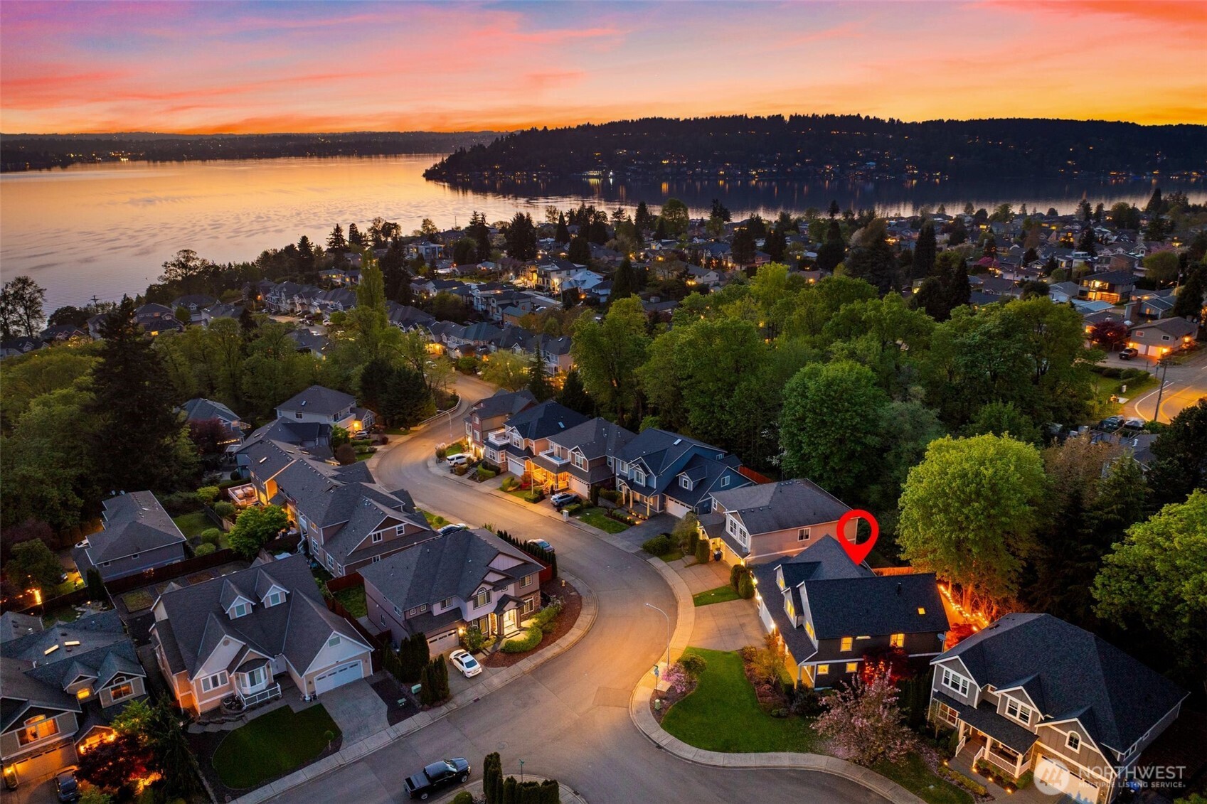Step into this beautifully refreshed home where a grand entry and soaring ceilings create an immediate sense of space and elegance. The open-concept kitchen flows into a spacious living room with a cozy gas fireplace and custom built-ins—ideal for everyday living and entertaining. Just beyond, a private backyard patio offers the perfect setting for relaxing or hosting guests. Upstairs, the expansive primary suite is a true retreat, featuring its own gas fireplace, oversized walk-in closet, and a luxurious feel. Two additional bedrooms, a large bonus room with abundant storage, and a versatile main-floor den or office provide flexible living space. A 3-car garage adds exceptional convenience with ample room for vehicles, storage, and hobbies. Enjoy easy access to SeaTac Airport, Bellevue, and Seattle, plus a short stroll to sunset views at Coulon Park or Kennydale Beach, along with shopping and dining at The Landing in Renton. Extensively updated in 2025, this move-in-ready home features a brand-new kitchen, renovated bathrooms, updated laundry room, new carpet, refinished hardwoods, new blinds (including electronic upstairs), and a finished garage with epoxy flooring. Exterior upgrades include fresh paint, new roof, gutters, downspouts, and garage doors. Outdoor improvements include a TimberTech deck, front patio, railing, and turf landscaping. Newer furnace and heat pump (2023). A rare opportunity with exceptional space, modern upgrades, and an unbeatable location.