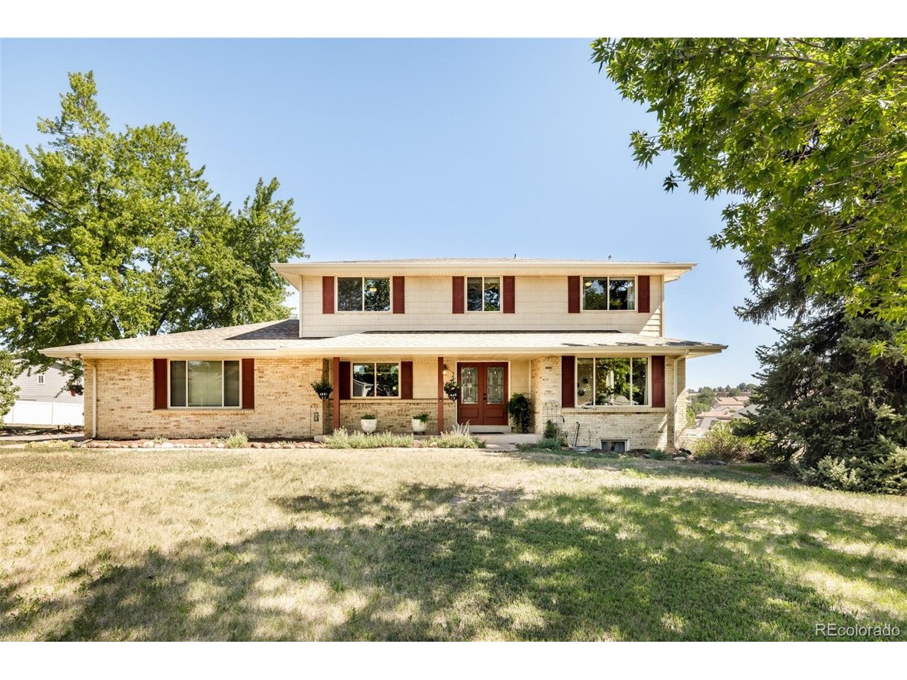 A rare and distinguished offering in Ken Caryl Acres, this equestrian property delivers the ultimate Colorado lifestyle on just over an acre of functional land. Purpose-built for the horse enthusiast, this property features a three-stall barn with covered hay storage and a loft with water and electrical, a fenced-in pasture and a dedicated shed with a tack room - an exceptional setup that is a unique find this close to amenities. Wonderfully maintained, the home is equally impressive, offering beautiful hardwood floors and skylights that bathe the interiors in natural light. The gracious floorplan unfolds with formal living and dining rooms, a spacious main family area with a cozy gas stove operable without electricity, and a private home office with its own exterior access. The eat-in kitchen impresses with generous cabinetry, featuring skylights and sliding glass doors that connect seamlessly to a back deck. This horse property location is sure to impress.