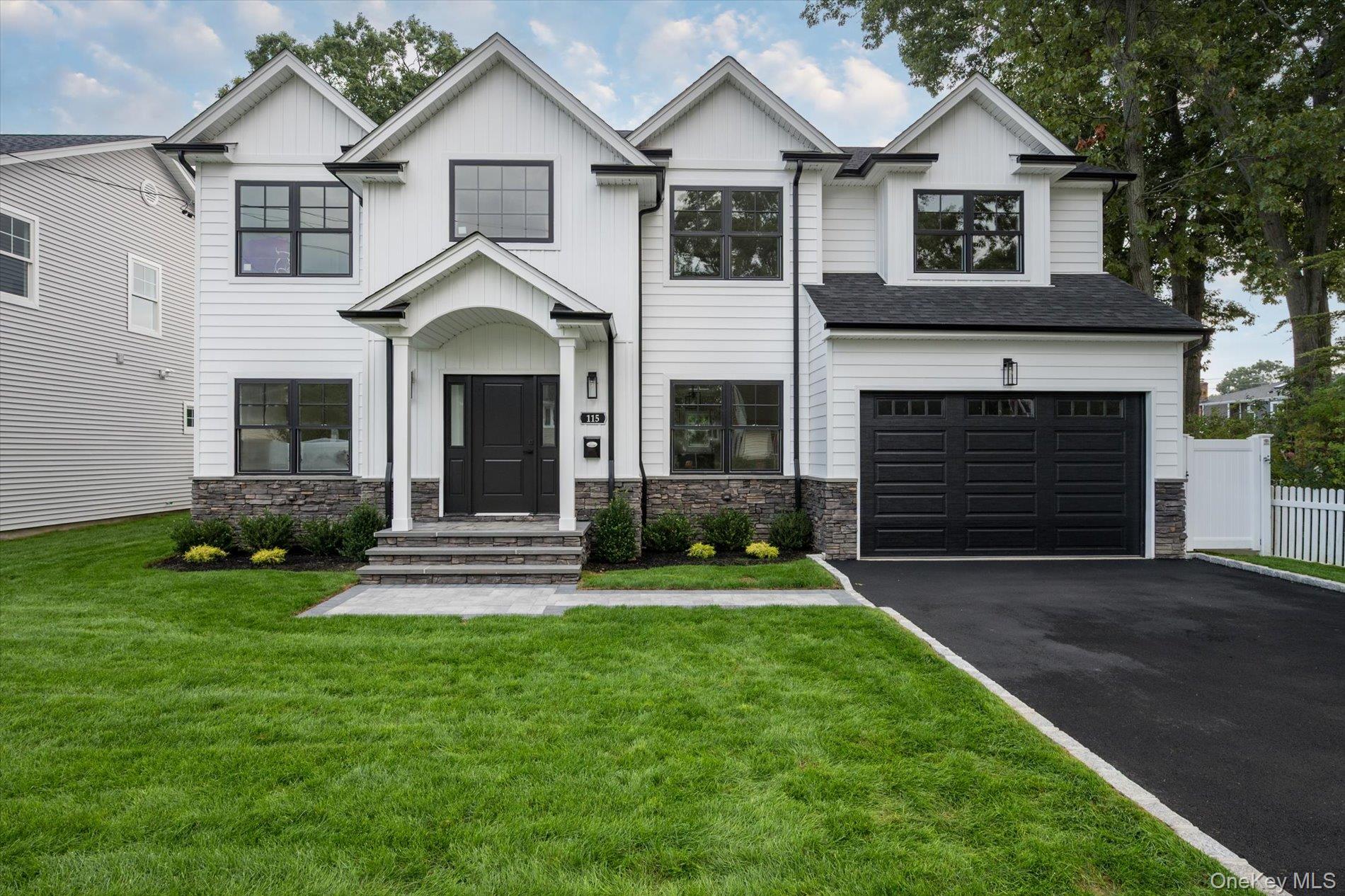 Beautiful Brand New Colonial! Open First Floor Layout with Huge Eat-In-Kitchen, White Quartz Countertops, Gourmet Commercial Appliances, Large Island with Seating. 9' Ceilings on First Floor with Two-Story Foyer. 8' Ceilings in Basement. 5 Bedrooms/ 3 Full Bathrooms Total, Including First Floor Bedroom. Four Generous Sized Bedrooms on Second Floor Including Huge Primary Bedroom and Primary Bathroom with Double Vanity, Walk-In Shower and Soaking Tub. Second Floor Laundry Room with Cabinets For Storage. Generous Amount Of Closets with Huge Walk-in Closet in Primary Bedroom. Wide Plank Hardwood Floors Throughout. Exceptional Craftsmanship and Detail with Extensive Moldings and Beautiful Coffered Dining Room Ceiling. Fully Landscaped with Underground Sprinklers, Fenced-In Rear Yard. Close to Town on Beautiful Residential Street.  Walking Distance to Stores, Schools, Public Transportation and Railroad.   This is One of Two New Homes Ready for Immediate Occupancy! Thise House Won't Last!