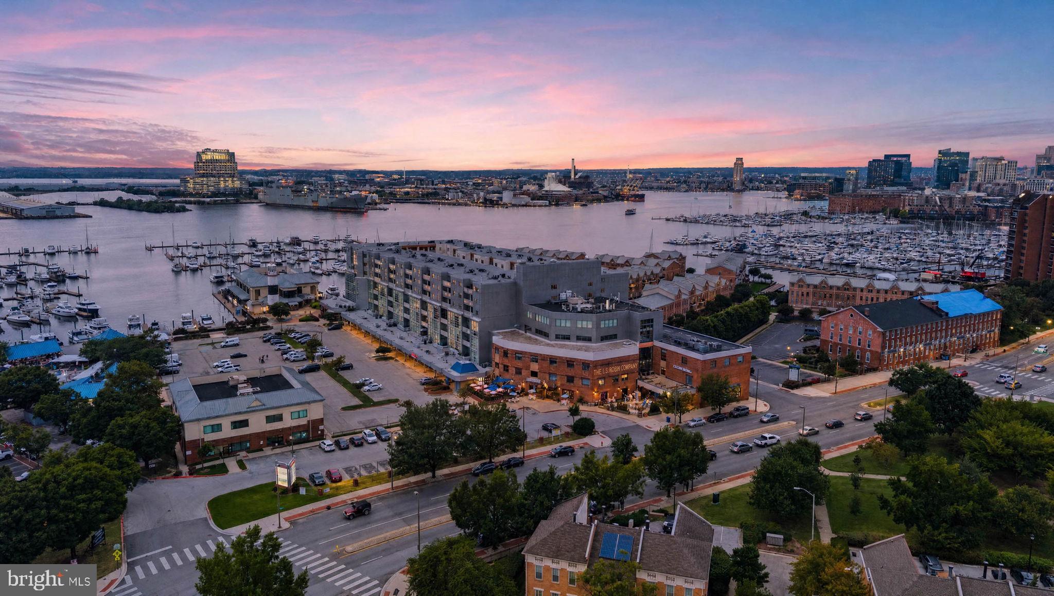 Enjoy the best of Canton living at 2702 Lighthouse Point East #629, a beautifully updated 2-bedroom, 2-bath condominium in the sought-after Lighthouse Landing Waterfront Community.The desirable split-bedroom floor plan places two spacious bedrooms on opposite sides of the open living, dining, and kitchen area, each offering a private full bath and spacious walk-in closet. A private balcony overlooks the community's expansive interior courtyard, providing an inviting outdoor extension of the home.Lighthouse Landing offers an impressive array of amenities, including gated entry with 24-hour security, on-site management and front-desk service, a deeded garage parking space, two fitness centers, three elevators, beautifully maintained grounds, and retail conveniences within the building. Ideally located along the Baltimore Waterfront Promenade, residents enjoy miles of waterfront walking and biking, with restaurants, shops, and nightlife just steps away.  With easy access to Johns Hopkins, Downtown and Penn Station, Unit 629 combines thoughtful design, full-service amenities, and an exceptional Canton location for effortless waterfront living.