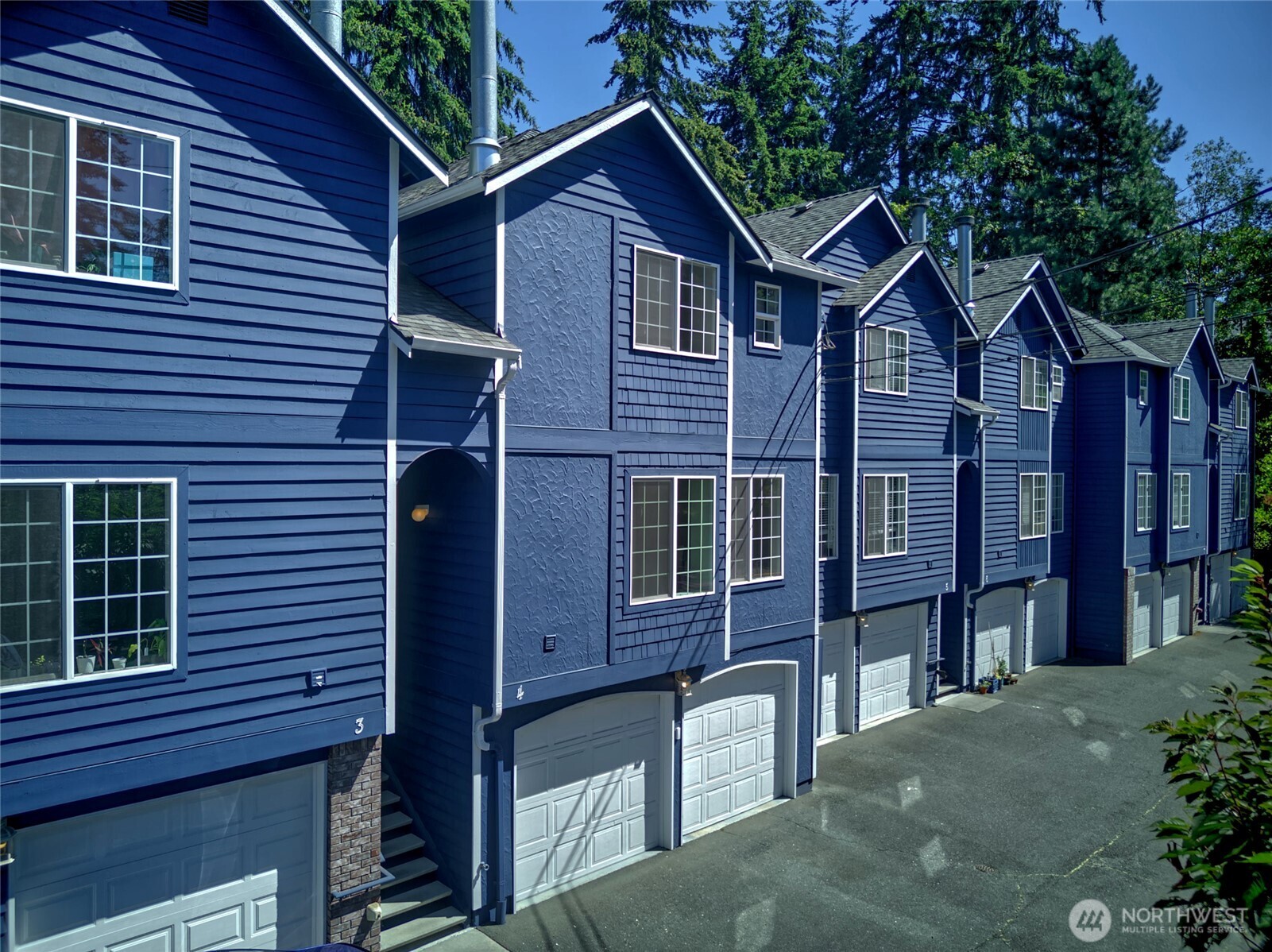Welcome to easy Edmonds living in this light-filled home just minutes from downtown! Large, mostly west-facing windows and skylights bring beautiful natural light throughout, while the thoughtful main-floor layout creates an open, easy flow from room to room. The kitchen features a standout farmhouse-style sink, and downstairs, a versatile bonus room offers the perfect space for a home office, gym, hobby room, or cozy retreat. Enjoy your own private backyard garden plus a shared dog run maintained by the HOA. An oversized garage provides plenty of room for parking, storage, and all the extras. The well-run HOA keeps things refreshingly simple, covering landscaping, exterior window cleaning, and exterior maintenance so you can spend more time enjoying your home and community. And the location is hard to beat—just minutes from downtown Edmonds, with convenient access to I-5, Shoreline, Seattle, and light rail. Bright, comfortable, connected, and close to everything that makes Edmonds such a special place to call home.