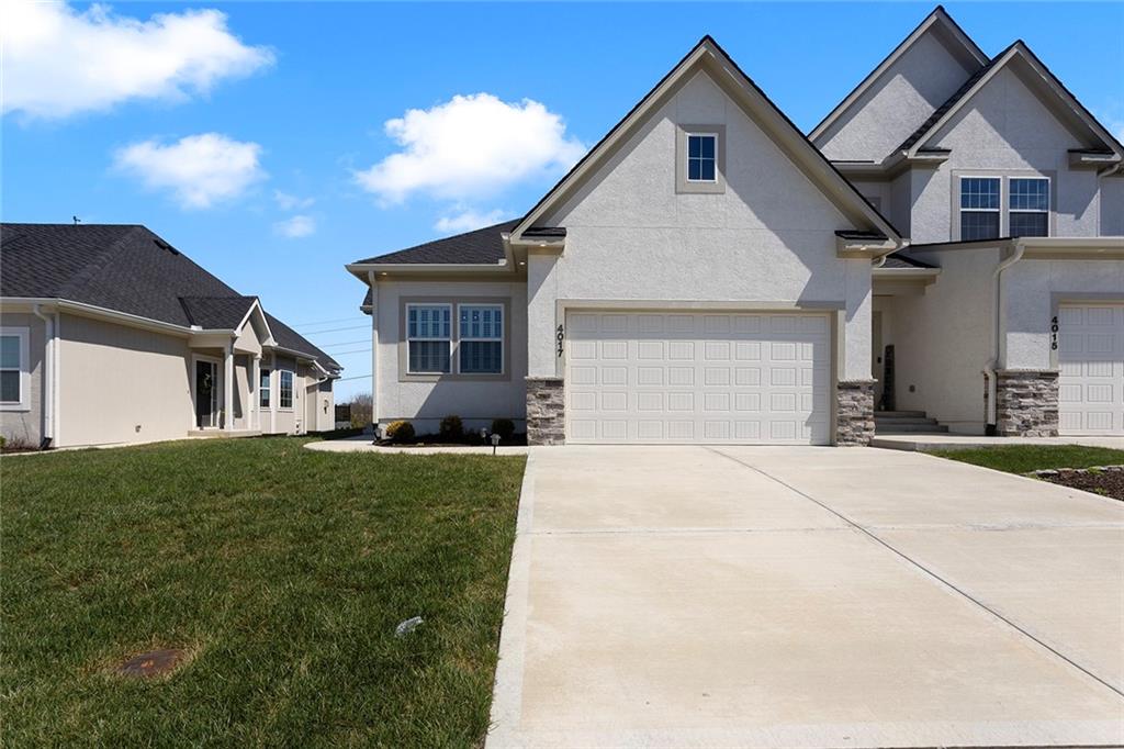 Welcome to luxury, low-maintenance living in the highly desirable Lakewood Chapel Ridge Woods! This stunning Ranch-style townhome, built just 3 years ago by Kevin Higdon Construction, features the sought after Benjamin floor plan and offers added privacy of an end unit. Step inside to discover gorgeous blonde luxury flooring and a spacious entryway with a convenient mudroom area. The chef's kitchen is a true showstopper, complete with a gas stove, pull out microwave drawer, stainless steel appliances, beautiful granite countertops, upscale subway tile, walk-in pantry & under counter lighting. Elegant crystal lighting and chandeliers throughout. The open dining area is filled with natural light and accented by Plantation Shutters making it warm & inviting. The primary suite is generously sized with tall ceilings and a private en-suite featuring dual vanities, walk-in shower, spacious walk-in closet and a conveniently located laundry. Speed Queen washer/dryer staying with the home. The second bedroom is also spacious and features Plantation Shutters for added privacy and charm. Additional highlights include two car garage and an unfinished daylight basement, offering incredible potential to add two more bedrooms and additional living area. Enjoy peaceful outdoor living with a spacious deck in the back that backs to green space. HOA provides true maintenance free living, covering building maintenance, lawn care, snow removal, trash service and prof. management. Residents can enjoy access to exceptional amenities including a boat dock, clubhouse, community center, exercise room, golf, party room, play area, putting green, swimming, and tennis courts. This is the perfect blend of luxury, convenience, and lifestyle, don't miss your opportunity to call it home. Priced to sell!