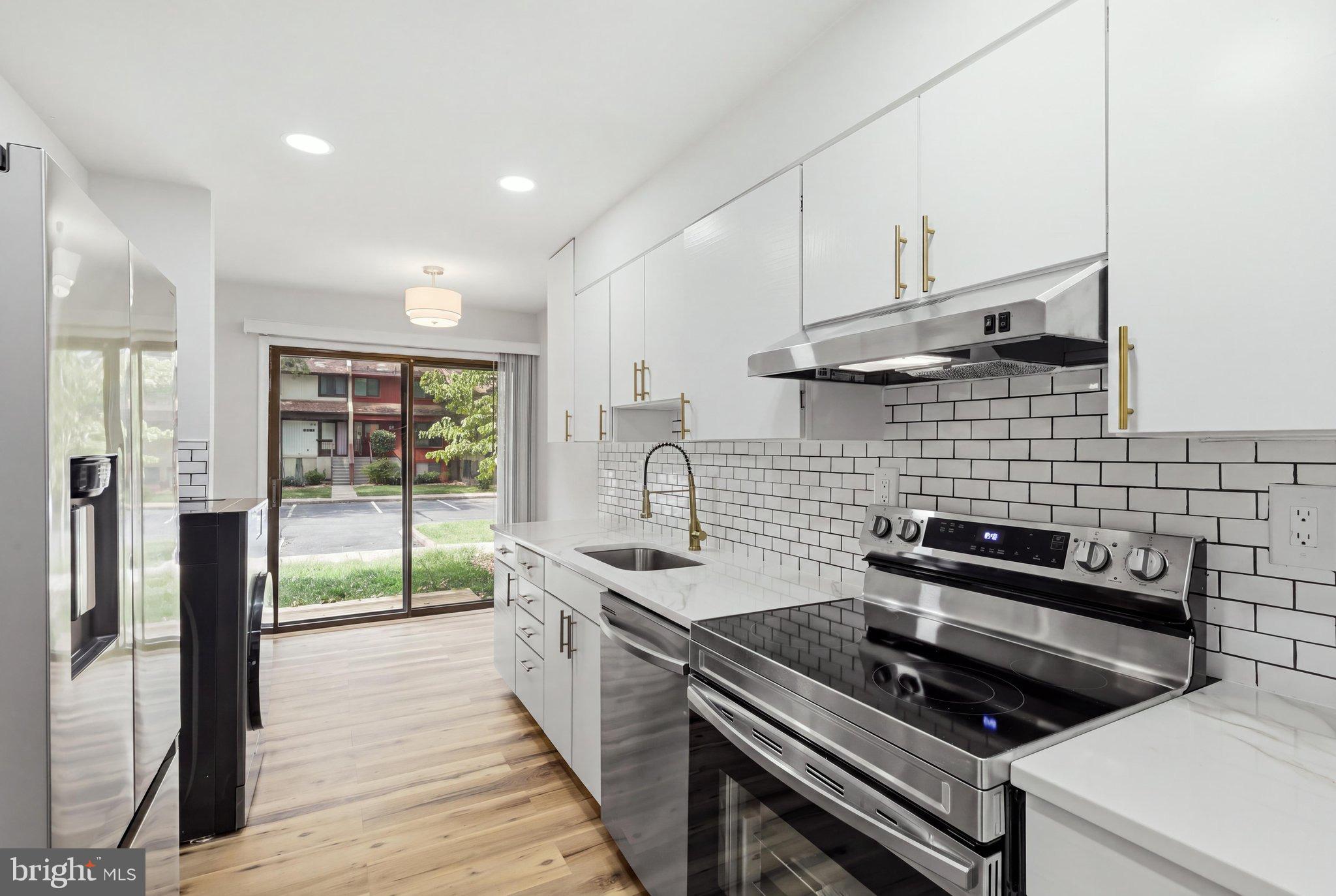Beautifully updated two-level townhouse in the desirable Reston community! This move-in-ready home features two bedrooms and two-and-a-half bathrooms with modern updates throughout. The main level offers a bright and inviting living area, an updated kitchen, and a dining space. Additional improvements include refreshed bathrooms, newer flooring, recessed lighting, modern fixtures, and a newer HVAC system. Enjoy a huge patio with a private fence in the back surrounded by mature trees.The home includes two reserved parking spaces directly in front for everyday convenience, along with nearby visitor and street parking. Walk to the local elementary school and take full advantage of everything Reston has to offer—55+ miles of scenic trails, 4 lakes, 15 pools, 50+ tennis and pickleball courts, plus numerous parks and community centers. Ideally located near Reston Town Center, the Silver Line Metro, Washington Dulles International Airport, and major commuter routes, this is an exceptional opportunity to own in one of Northern Virginia's most sought-after locations!