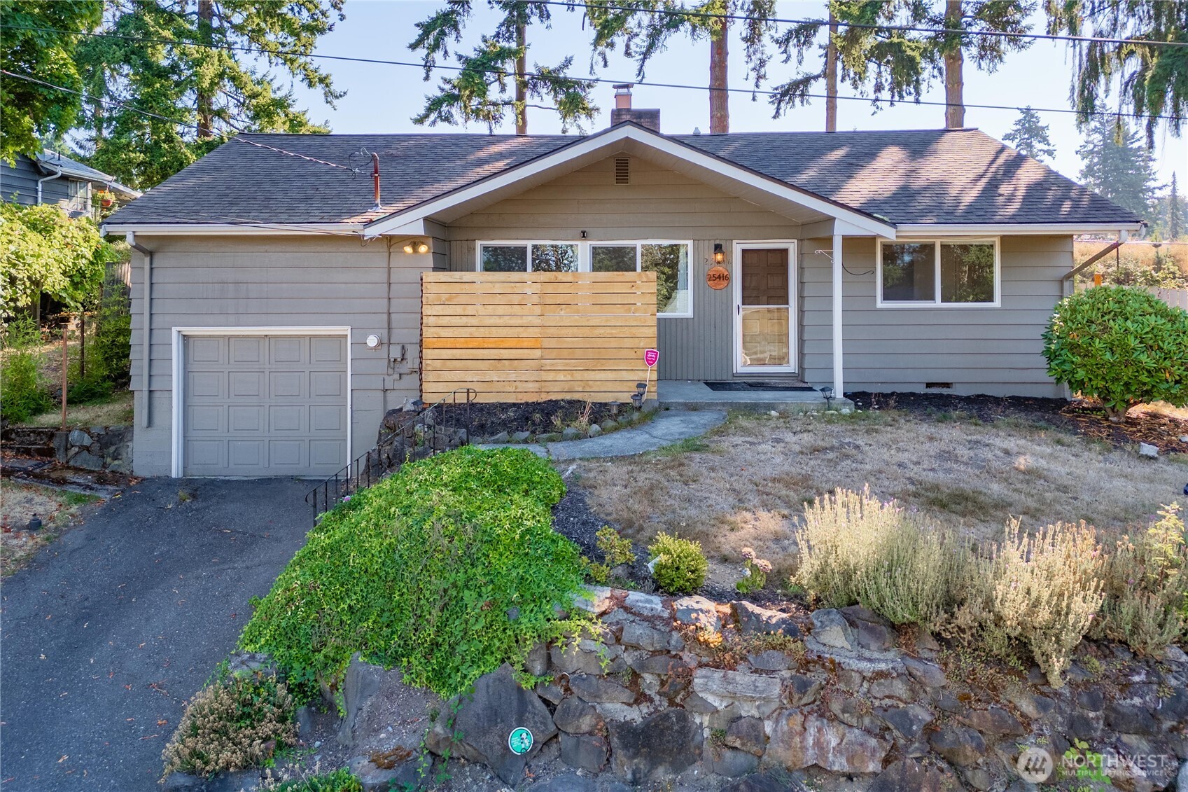 PRICE REDUCED to under $500K for this charming 3BR/1BA single-story home in a quiet Kent cul-de-sac with no HOA! Enjoy a spacious living room with wood-burning fireplace & a large picture window for natural light. The galley kitchen features white cabinets & newer stainless appliances. Fresh paint, LVP flooring, modern fixtures & white trim throughout. Oversized primary bedroom/flex space above garage. Huge fully fenced backyard with covered outdoor cooking area - perfect for entertaining! All appliances, including washer/dryer, stay. 1-car garage & great location near shopping, dining & commuting. Move-in ready!