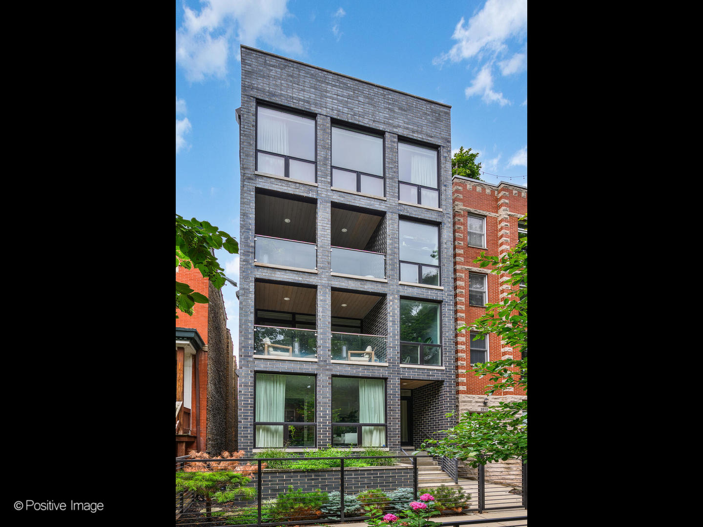 This 2017 Contemporary Concepts build feels like new and outshines anything else at this price point. Nestled just one block west of Halsted, it offers the allure of a quiet, leafy-green residential street with coveted proximity to East Lakeview and Wrigleyville. The impressive curb appeal with gated front entry and impeccable landscaping welcomes you to an intimate, 3-unit building where the interior of this second floor simplex does not disappoint.    Inside, the open design features a bright living and dining area, a sunny office nook, and a striking kitchen with paneled Sub-Zero, Wolf, and Asko appliances, Archisesto cabinetry, and a stunning waterfall quartz island. Floor-to-ceiling windows lead to a private front terrace with built-in firepit, ideal for entertaining or relaxing while taking in the beautiful east-facing view of Reta Avenue.    The primary suite features a professionally organized walk-in closet and spa-like bath with an oversized stone shower, rain head, and floating double vanity. The versatile guest bedroom features a Murphy bed, offering multi-use flexibility as a bedroom, fitness studio, work-from-home space and more. Upgrades include custom Hunter Douglas smart-home automated shades, smart lighting, and a new Navien tankless water heater. A large hallway closet offers both in-unit laundry and storage solutions. One included garage parking space completes this remarkable home. Enjoy walkable access to the lakefront, Belmont Harbor, Addison Red Line, Whole Foods, Wrigley Field, and some of the city's most popular dining and nightlife in Chicago's hottest neighborhood.