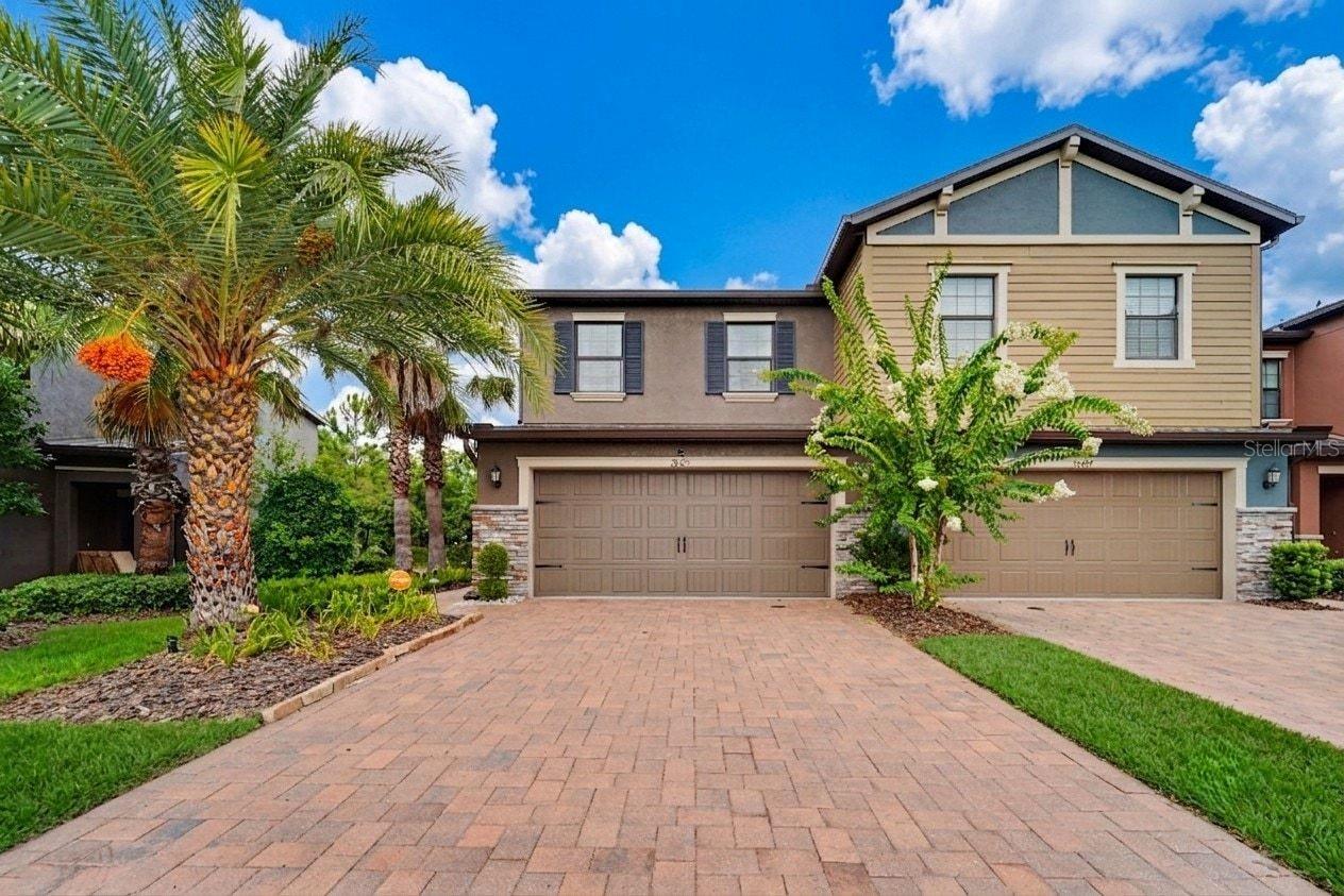 STOP SCROLLING. ONE ORIGINAL OWNER. IMMACULATE CONDITION. THIS IS THE ONE! Imagine sipping your morning coffee on a private screened patio — sun perfectly filtered by an added shade screen — while a serene pond mirrors the Florida sunrise and wildlife drifts lazily across the conservation view behind you. No rear neighbors. No yard work. No waiting to build. Just move-in ready, maintenance-free luxury in one of Wesley Chapel's most beloved communities — and it's been waiting for exactly the right buyer.Welcome to 28425 Pleasant Bay Loop at the Arbors at Wiregrass Ranch, where seven years of meticulous original-owner care have kept this stunning Capri floor plan townhome in showroom condition. At 1,801 sq ft with 3 bedrooms, 2.5 baths, and a 2-car garage, every inch of this home reflects pride of ownership that simply cannot be replicated.The open-concept main floor is made for real life — impressive foyer entry with wide-plank oak luxury vinyl flooring flowing throughout, leading into a chef-worthy kitchen featuring custom staggered 42" cabinets, granite countertops, stainless steel appliances, a large breakfast bar, and a walk-in pantry built for the way families actually live. Step outside to your private screened patio and let that breathtaking pond view do the rest.Upstairs, the primary suite delivers the retreat you deserve: a sitting area, garden soaking tub, oversized walk-in shower, granite countertop with dual sink vanity, and a walk-in closet worthy of a standing ovation. Two additional bedrooms and a full hall bath complete the upper level.Here's what truly sets this home apart: **BLOCK on-BLOCK construction on BOTH floors** — superior durability, quieter living, better energy efficiency, and lower insurance costs. At this price point in Wesley Chapel? That is rare.And the location? An absolute 10. Step outside and you are literally next door to the community pool and cabana — we're talking steps, not a walk. Start your morning on the wetland and pond walking trails winding through Wiregrass Ranch, then unwind at Wildflower Park or Tranquility Park. Catch a movie under the stars at Porter Park's community movie screen, and let your four-legged family members burn energy at Central Bark Dog Park. This community doesn't just have amenities — it has a lifestyle.Beyond the gates, Wiregrass Elementary, Dr. John Long Middle, and Wiregrass Ranch High School are all within 1.5 miles — among Pasco County's most coveted schools. The Wiregrass Ranch Sports Campus is 3 minutes out, The Shops at Wiregrass and premier dining just 5 minutes away, and seamless I-75 access puts Downtown Tampa and TIA a smooth 30–35 minutes from your front door.Your HOA covers the pool, exterior maintenance, grounds, exterior paint, roof replacement, and trash — so your weekends stay completely, gloriously yours.**Original owner. Immaculate inside and out. Steps from the pool. And a pond view that will stop you in your tracks.**Homes like this don't wait. Book your appointment and make it yours before someone else does.