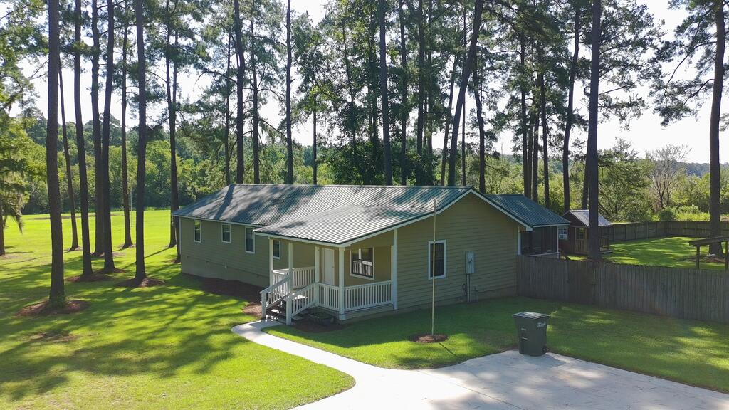 Big Value Property!  Almost 5 Acres with a 4 Bedroom / 3 Bath Home.  Part of Lake Riverside.  A Feels Good, Looks Good Property from Top to Bottom!   New Flooring, New Paint, Private Pond, Lake Front, Workshop/Shed, Playhouse, Privacy Fenced Back Yard, Towering Pines, Laundry Room with Sink,  Garden Area, Privacy. Beautiful Counter Tops in Baths and Kitchen!  Everyone could be happy in this home...and did I mention you could Fish?  Low Maintenance Metal Roof and Crawl Space encapsulated.  Check out 70+/- Acre Lake Riverside.