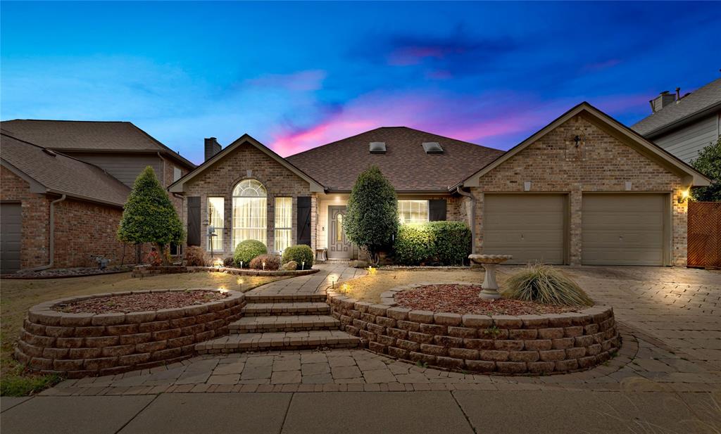 ***This home qualifies for a limited-time lender-paid 2-1 buydown- reduced monthly payments for the first 2 years at no cost to the buyer or seller. Ask listing agent for details!*** Welcome home to this beautifully updated gem in the heart of Flower Mound! From the moment you arrive, you’ll love the stunning curb appeal and designer driveway that set the tone for what’s inside. Thoughtfully designed with family living in mind, the ideal floor plan features all bedrooms downstairs, two spacious living areas, a formal dining room, and a sunny breakfast nook- perfect for everyday moments and special gatherings alike.Soaring high ceilings, hand-scraped hardwood floors, and elegant crown molding add warmth and character throughout. The chef’s kitchen shines with easy-to-clean tile counters, oven with warming drawer, and plenty of space to cook, host, and connect. The luxurious primary suite offers a relaxing garden tub and a custom California Closet for exceptional organization.Upstairs, a versatile loft with 348 additional sqft provides the perfect space for a 5th bedroom, playroom, or home office. Step outside to your private backyard retreat with a sandstone patio and lighted pergola- ideal for evenings under the Texas sky. Located in the highly sought-after Flower Mound High School feeder pattern, this home truly has it all! Make it yours before it's gone!