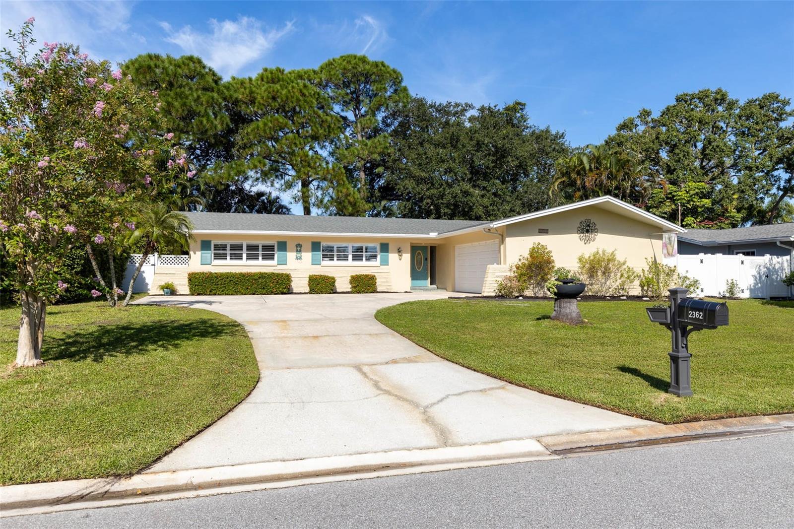 A RARE OPPORTUNITY TO GET INTO FAIRWAY ESTATES AND ENJOY EVERYTHING THAT MAKES DUNEDIN SUCH A SPECIAL PLACE TO LIVE! ……..This 3 bedroom, 2 bath home offers 1,608 heated square feet PLUS an additional 348 square foot enclosed Florida room, a TWO-CAR SIDE-ENTRY GARAGE and a FULLY FENCED BACKYARD…….. Inside, BRAND NEW LUXURY VINYL PLANK FLOORING and FRESH INTERIOR PAINT, both completed in AUGUST 2026, create a clean and updated backdrop throughout the home…... The kitchen was updated in 2017 and offers generous cabinetry, stainless steel appliances, ample counter space and breakfast-bar seating…….. The spacious living room opens through POCKETING SLIDING DOORS to the impressive Florida room, where walls of windows bring in natural light and create an easy extension of the living space for relaxing, dining or entertaining……. Open the sliders and this 348 square foot room feels beautifully connected to the rest of the home……. Outside, the fenced backyard offers patio space, mature shade trees and room to garden, play or simply enjoy the Florida weather….. The 120 square foot detached STORAGE SHED WITH ELECTRICITY AND WALL A/C adds another fun and flexible space for a workshop, art studio, fitness room, hobby area, home office or backyard retreat. System dates 2019 water heater, 2013 roof, 2008 HVAC….But the real story here is the LOCATION……. FAIRWAY ESTATES is one of Dunedin’s most loved and established neighborhoods, known for its tree-lined streets, distinctive homes, strong sense of community and beautiful LAKE SAUNDRA at its heart…... The neighborhood sits beside the historic DUNEDIN GOLF CLUB and puts you close to so much of what makes this city special. Ride or walk the PINELLAS TRAIL, spend the afternoon at HIGHLANDER PARK, HAMMOCK PARK or the DUNEDIN COMMUNITY AND FINE ART CENTERS, head to HONEYMOON and CALADESI ISLAND State Parks and the Gulf beaches, or make your way downtown for locally owned restaurants, breweries, shops, festivals, markets and waterfront sunsets..... Fairway Estates gives you that hard-to-find combination of an established neighborhood feel while keeping you close to the energy and personality of DOWNTOWN DUNEDIN....... If you’ve been waiting for an opportunity to make FAIRWAY ESTATES your home, THIS MAY BE THE ONE YOU’VE BEEN WAITING FOR.