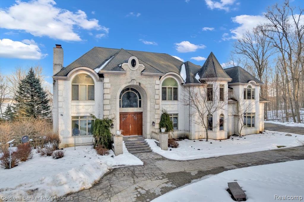 Lakefront Legacy Estate – 9 Private Acres on All-Sports Lake NepessingSet behind the gates of an exclusive community, this extraordinary waterfront estate offers a rare combination of luxury, privacy, and panoramic beauty. Spanning 9 pristine acres with premium frontage on all-sports Lake Nepessing, the property delivers unmatched seclusion while showcasing breathtaking water views from nearly every room.Designed for both grand-scale entertaining and refined everyday living, the residence features over 7,000 square feet of primary living space, complemented by an additional 3,300+ square feet in the finished walk-out lower level. Meticulously maintained and thoughtfully appointed, every detail reflects quality craftsmanship and timeless design.An elevator services all three levels, ensuring effortless access throughout the home’s expansive layout. The estate offers eight spacious bedrooms, 7 1/2 bathrooms, 5 fireplaces, upper and lower level laundry facilities, providing exceptional comfort for family and guests alike. Two full kitchens create flexibility for entertaining, hosting extended stays, or multi-generational living.The walk-out lower level is designed for lifestyle and leisure, complete with a private movie theater and seamless access to the lakefront grounds. Walls of windows frame stunning lake vistas, while mature trees and professionally curated landscaping create an atmosphere of complete privacy.Whether enjoying peaceful mornings overlooking the water, hosting elegant gatherings, or embracing the recreational lifestyle of this sought-after all-sports lake, this property represents a rare opportunity to own a true generational retreat.A legacy estate. A private waterfront sanctuary. A lifestyle without compromise. BATVAI