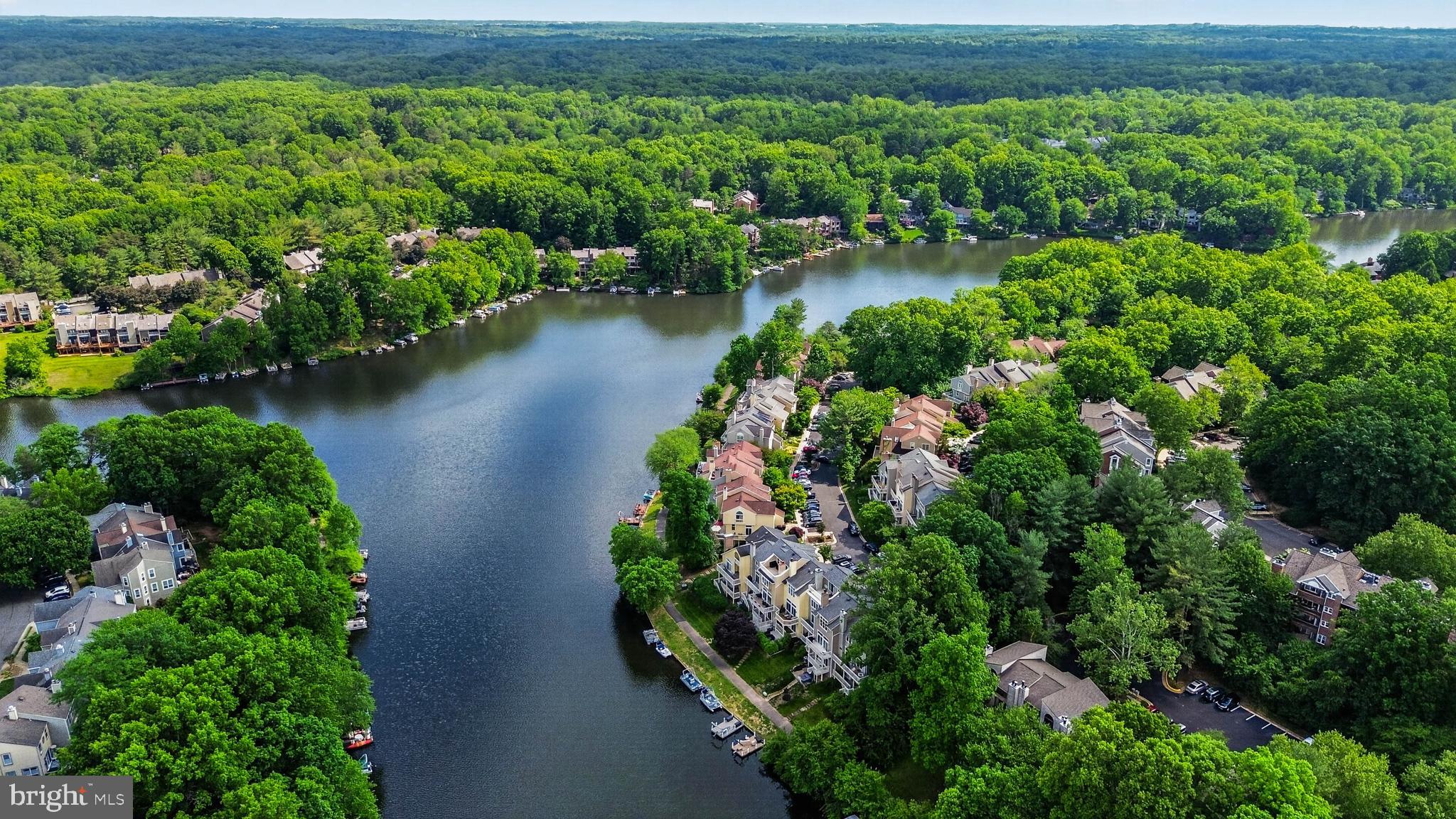 Welcome to one of Reston's premier waterfront residences, where exceptional lakefront living meets timeless design. Perfectly positioned along the water's edge, this beautifully renovated three-bedroom, three-and-a-half-bath townhome offers stunning, unobstructed lake views from every level, creating a picturesque backdrop in every season.Thoughtfully updated from top to bottom, the home showcases a sophisticated blend of modern style and everyday comfort. Rich hardwood flooring, contemporary finishes, and expansive windows fill the interior with natural light while framing the spectacular waterfront setting from nearly every room. The redesigned kitchen is both elegant and functional, featuring stainless steel appliances, sleek cabinetry, and carefully selected finishes that make it equally suited for daily living and effortless entertaining.The home's bathrooms have been completely remodeled with designer tile, stylish fixtures, recessed lighting, and spa-inspired finishes, creating a luxurious and cohesive feel throughout. Numerous recent improvements add both value and peace of mind, including a newer roof, an HVAC system replaced approximately 18 months ago, energy-efficient Pella sliding glass doors, a new front entry door, and an oversized washer and dryer. Additional enhancements, including new siding and contemporary glass railings, complement the home's clean architectural lines while enhancing its bright, open atmosphere.Enjoy your own private outdoor retreat from the spacious balcony overlooking the lake—an ideal setting for morning coffee, evening sunsets, or simply relaxing while taking in the peaceful waterfront surroundings. Located within one of Reston's most sought-after lakefront communities, residents enjoy direct access to boating, canoeing, paddleboarding, and a variety of lakeside recreational activities. An available boat slip offers even greater opportunities to embrace the waterfront lifestyle. The home also includes two assigned parking spaces (#3) for added convenience.Offering exceptional renovations, quality upgrades, and some of Reston's most captivating year-round waterfront views, this remarkable residence presents a rare opportunity to enjoy luxury lakefront living at its finest.