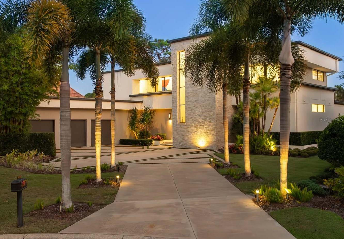 One or more photo(s) has been virtually staged. This stunning, contemporary residence is perfectly poised along the 2nd fairway of Lake Nona Golf & Country Club’s championship golf course. Built by Phil Kean Design Group in 2016, the two-story floor plan redefines modern Lake Nona living with its minimalist architecture and stylish interior centered on an indoor-outdoor lifestyle.

The interior of this five-bedroom home brings a refreshing blend of current design, comfort and pure luxury. The open, glass-railed staircase serves as a focal point throughout the primary living area, which includes the living room, expansive kitchen and dining areas and a well-appointed master suite.  

A dramatic dual-sided fireplace creates an elegant anchor point for the modern aesthetic and can be enjoyed from the living room, dining room and kitchen area, which features Lauriermax cabinets, Wolf and Sub-Zero appliances, a dedicated wine refrigerator, a sleek breakfast bar and convenient pass-through access to the outdoor kitchen. 

Designed for indoor-outdoor living, floor-to-ceiling glass sliding doors open to reveal serene golf views, a 58-foot open-air pool with sun shelf and spa, and a generous covered lanai with summer kitchen and motorized retractable screens. 

The second floor features four additional bedrooms, all with en suite baths and access to the expansive exterior balcony that maximizes the extraordinary multiple fairway views and offers the ideal space for guests and family. 

Additional features include:
• Master bath with private wet room, multiple jets and free standing tub
• Second floor loft bonus room/home office
• 3-car garage with epoxy floors
NOTE: The seller has proactively conducted a home inspection and performed exploratory demolition in the primary bedroom suite to better understand the scope of necessary repairs. Additionally, the original builder, Phil Kean Design Group, has provided a detailed proposal and estimate for the recommended work. This documentation is available upon request.