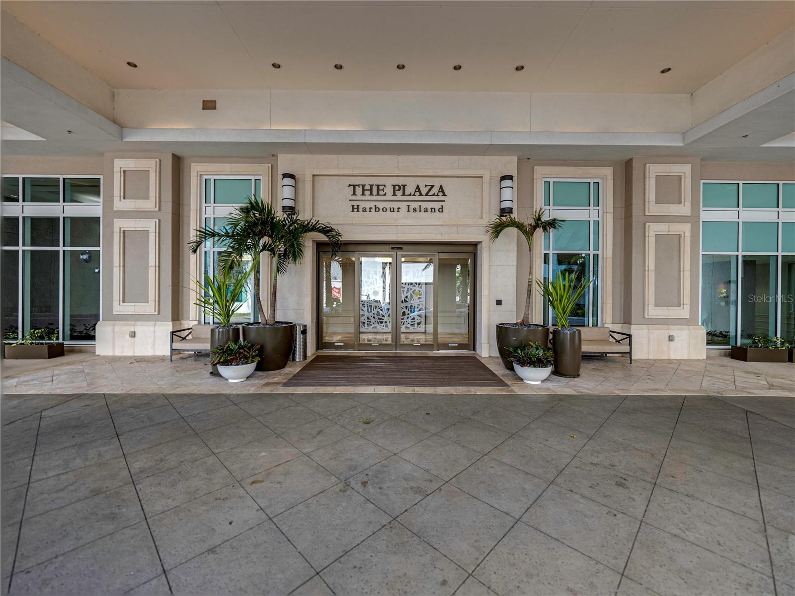 Experience a distinctive level of luxury living at The Plaza Harbour Island, where the spaciousness of a private residence meets the convenience of one of downtown Tampa's premier condominium communities. This exceptional two-story residence offers 2,636 square feet of beautifully renovated living space, featuring two bedrooms, two full bathrooms, a powder room, and two assigned parking spaces. With a floor plan unlike any other in the building, Residence 405 offers a truly unique opportunity.From the moment you enter, soaring ceilings, abundant natural light, and thoughtfully curated finishes create an atmosphere of understated elegance. The expansive open-concept living and entertaining spaces feature custom built-ins, an elegant entertainment wall, and a beautifully designed beverage station with a GE Monogram refrigerator. The gourmet kitchen is equally impressive, showcasing Cambria quartz countertops, premium Jenn-Air appliances, a generous center island, breakfast bar, and designer appointments that seamlessly blend beauty and functionality.The thoughtfully designed two-level layout provides a wonderful separation between living and private spaces, creating a residence that feels more like a luxury townhome than a traditional condominium. Spacious bedroom retreats, beautifully appointed bathrooms, and generous storage complete this exceptional home.Ideally situated on the fourth-floor amenity level, Residence 405 offers convenient access to The Plaza's resort-style amenities, including a spectacular infinity-edge pool, state-of-the-art fitness center, spa, sauna, resident gathering spaces, 24-hour concierge, and valet services.Located in the heart of Harbour Island, just moments from Water Street, the Tampa Riverwalk, Amalie Arena, acclaimed restaurants, shopping, and entertainment, this residence places the very best of downtown Tampa at your doorstep.Rare in design, exceptional in quality, and unmatched in convenience, Residence 405 offers an extraordinary opportunity to enjoy luxurious urban living at The Plaza Harbour Island.