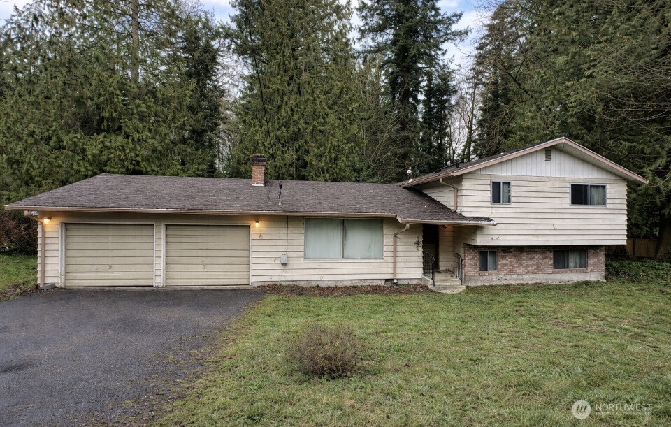 First time on the market in 50 years. This fixer, located on the west side of Puyallup, is on a very large cul-de-sac lot with a small creek at the base. Towering cedars provide a peaceful setting as you hear the water in the background from your back deck. This estate is a fixer project in a very desirable and hard to find location and homes don’t last in this area. Remodelers dream, taking on this home will be very satisfying, Landscape a trail down to the brook and create a picnicking area. I would not wait to see this property, because you will likely not have a chance to find such a wonderful setting in the area again!