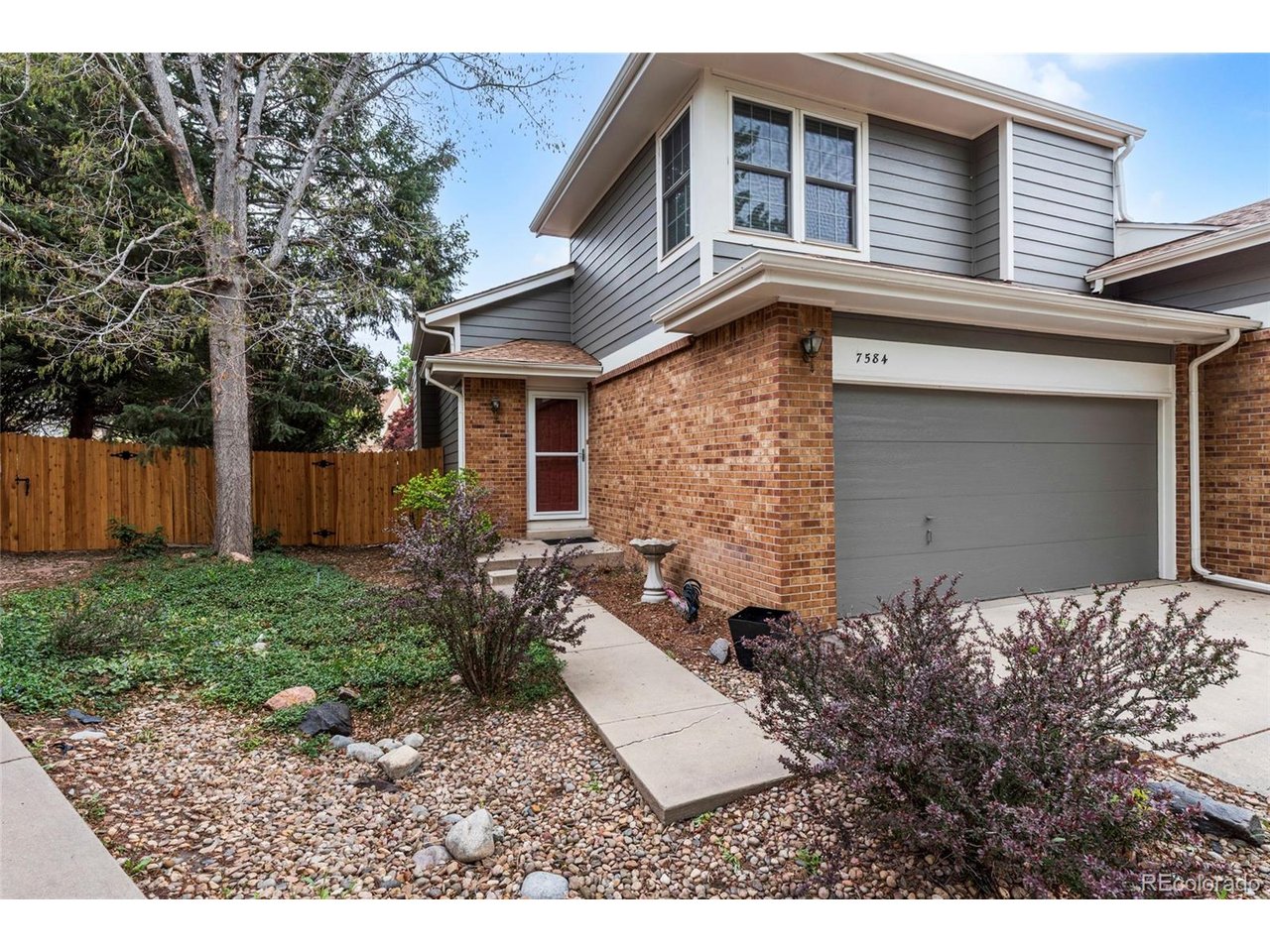 Pristine 1/2 Duplex in sought after Indian Creek area.   Beautiful fully remodeled 2 bedroom 1/2 bath home with modern finishes in kitchen and baths.   Granite countertops, stainless steel appliances,  gas stove and nice sized kitchen island with abundant counter and storage space.    Walk out large double glass doors to delightful large private back yard.  Tons of light and charm in the vaulted great room with plenty of room for books, curio cabinets or displays of favorite pics.  Windows galore fill both upper bedrooms.   Master has walk in closet and plenty of room for queen size bed and bureau.   Enjoy peace of mind with all major systems replaced in last 5 years and new roof in 2019.  Low HOA of $143/month cover community pool and tennis court. Attached 2 car garage and cul de sac make it an ideal and quiet location.   Close to shopping and blocks away from Hi-line trail. easy commute to Cherry Creek, Lowry or DTC