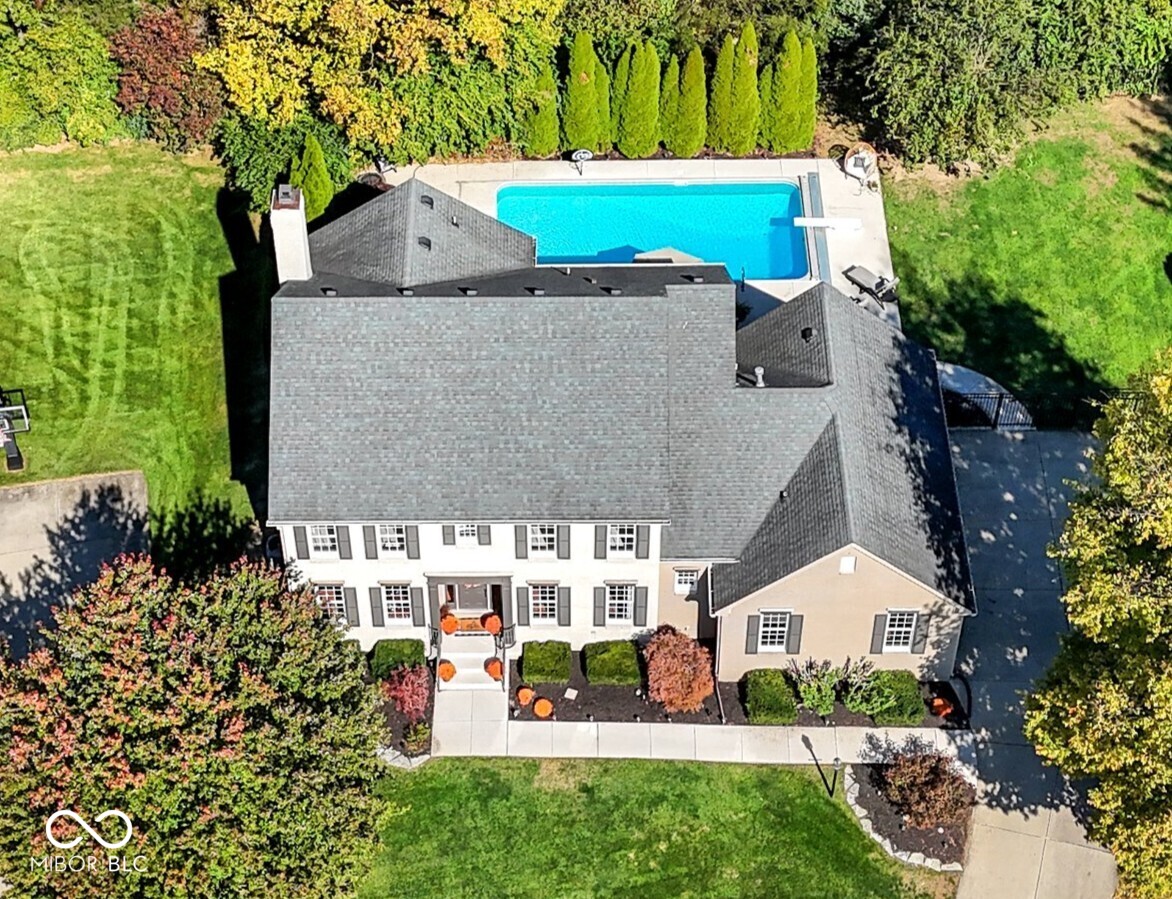 RARE FIND in HAMILTON PROPER - Fishers' Premier Country Club Community! BEAUTIFUL CUSTOM HOME w/ELEGANT OFFICE & FIN BASEMENT + BACKYARD OASIS w/SPARKLING IN-GROUND POOL & EXPANS ENTERTAINING PATIO & LAWN! Perched on elevated PRIVATE HOMESITE on QUIET CUL-DE-SAC w/FENCED YARD & LUSH MATURE TREES, a short walk to Hawthorns Golf & CC in Hamilton Proper, where members enjoy a gorg clubhouse, dining, social events, pool, tennis, pickleball, playground, world-class golf + social events, swim team & junior golf leagues for kids!  Nestled amid winding, tree-lined streets, luxury custom homes & 279 acres of woods & wetlands, Hamilton Proper offers an unmatched setting where nature & elegance meet. Enjoy a luxury retreat in your own backyard- lush, tree-lined oasis featuring refreshing in-ground pool, expans patio for entertaining w/ bar & outdoor grilling station, area for multiple outdoor furniture settings, fire pit & large fenced yard for loads of outdoor fun! Offering 4,274 fin sf this 4-BR, 3 full + 2 half bath home delivers both elegance & comfort w/ideal plan for living & entertaining. Stately Home Office w/French doors, formal Dining + spacious GR w/masonry hearth offers seamless indoor-outdoor entertaining w/sliding door to a backyard paradise. Gourmet Kitch ~fully equipped w/stainless-steel appliances, island w/cooktop & seating, dining area & direct patio access for indoor-outdoor living. Luxurious Owner's Suite features raised ceiling, spa bath w/soaking tub, dual vanities, sep walk-in shower,TWO LRG walk-in closets + 3 add'l spacious BRs w/LRG closets & full bth upstairs. FIN BASEMENT boasts HUGE 2ND FR, Wet Bar & Rec Area, Exercise Rm or 5th BR, full bath  + abundant storage. NEARBY ATTRACTIONS ~ GEIST MARINA w/boat rentals, shops & waterfront dining; Hamilton Town Ctr shops; outdoor concert venues & farmer's markets; Daniel's Vineyard; Top Golf, plethora of rec sports & MORE!  Easy access to I69 & wider attractions of Indy! DON'T MISS OUT ~ ALL BOXES CHECKED!
