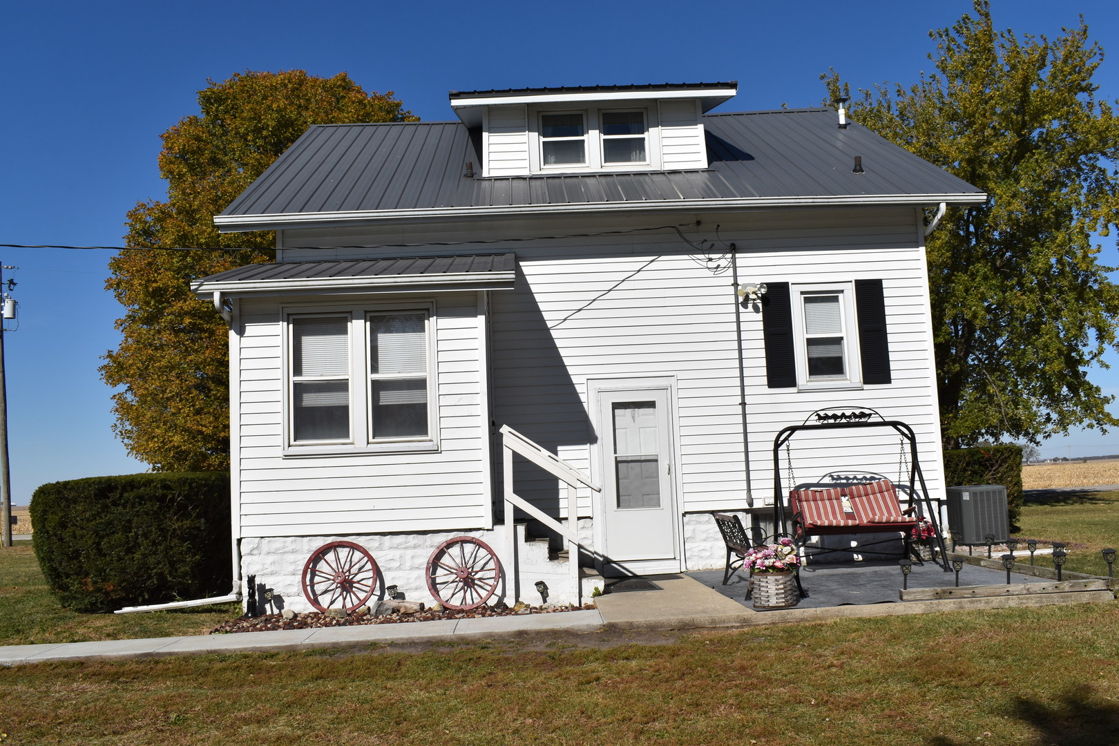 Horse lovers delight! 4.07 acres all fenced except the yard, a 30 x 70 barn with 4 -12x28 horse stalls, 11x11 tack room, feed room and water. Barn has metal siding and roof. There is one large pasture and two small pastures and a round pen. The house has 3 bedrooms, 2 bathrooms, kitchen, dining room, living room and full basement. 30 x 30 3-car detached garage with an attached 30x30 machine shed and a separate utility shed.