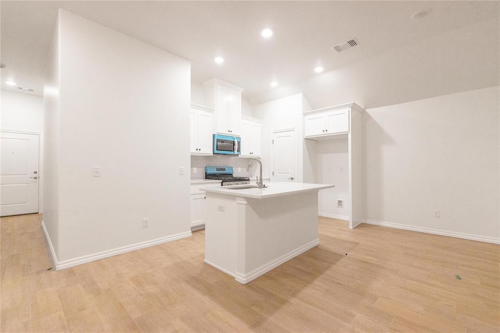 FENCING AND BLINDS INCLUDED! This John floor plan includes 1,310 Sqft of total living space, which includes 1,200 Sqft of indoor living space and 110 Sqft of outdoor living space. There is also a 385 Sqft, two car garage with a storm shelter installed. This new home offers 3 beds, 2 baths, 2 covered patios, and a utility room! The living room includes high ceilings, exquisite wood-look tile, a ceiling fan, the perfect sized windows, and Cat6 wiring. The kitchen spotlights custom-built cabinets with decorative hardware, stainless-steel appliances, decorative tile backsplash, elegant countertops, and wood-look tile. The primary suite features 2 windows, a ceiling fan, our cozy carpet finish, and a sizeable walk-in closet. Attached is the upgraded primary bath, which holds a dual sink vanity complimented by a 3 CM quartz countertop, satin nickel features, and a tub/shower combo. Outdoor living includes fully sodded yards, a smart home irrigation system, and 30-yr weather wood shingles. Other amenities include a water-saving tankless water heater, a fresh air intake system, R-15 & R-38 insulation, and so much more!