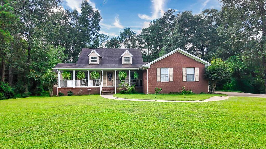 Welcome to 129 Cardinal Ridge Road, a beautifully situated home in the desirable Tall Pines subdivision of Thomasville. Offering approximately 2,422 square feet of comfortable living space, this well-maintained 3-bedroom, 3-bath home combines a functional layout with plenty of room to relax and entertain.  Step inside to a welcoming living room, formal dining room, and inviting den. The open kitchen flows into a bright breakfast area featuring a beautiful bay window, creating a warm and comfortable gathering space. The home offers two bedrooms and two full bathrooms on the main level, while the upstairs bedroom and full bathroom provide additional privacy and flexibility for guests, family members, or a home office.  A large laundry room provides excellent storage, while the attached two-car garage adds everyday convenience. Outside, enjoy the front porch and spacious back deck overlooking the fenced backyard. Set on approximately 0.84 acres, the property offers a wonderful combination of privacy, outdoor space, and neighborhood living.  With hardwood, tile, and carpet flooring, recessed lighting, a brick exterior, central cooling, and a peaceful setting, 129 Cardinal Ridge Road is a home with plenty to offer. Whether you're looking for comfortable everyday living or a place to entertain family and friends, this Thomasville property is worth a closer look.