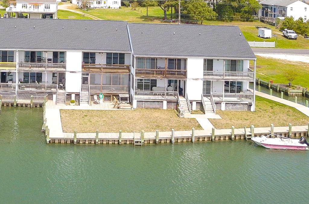 The View is EVERYTHING! Amazing WATERFRONT CONDO on DEEP WATER with the best Chincoteague views you can get. The Assateague Lighthouse, The Ponies, The beautiful Creeks and Channels, Full Moons, Sunrises, and more. Hard to put in words. This a low maintenance way to enjoy your beach house. Two Bedrooms, Two Full Baths. This one wont last long.