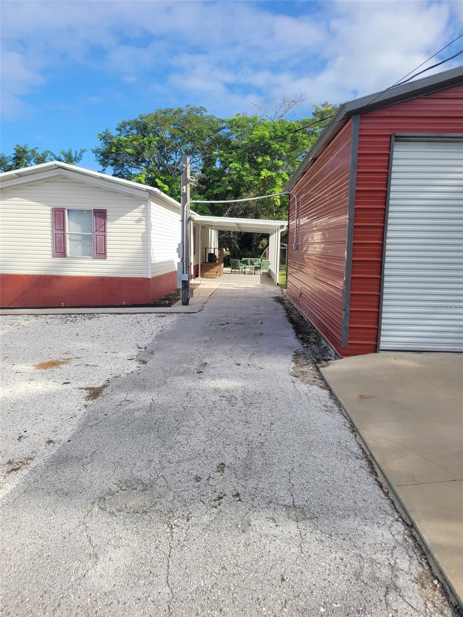Under contract-accepting backup offers. Great opportunity for someone who needs a lot of parking for their work trucks and trailers or toys with an insulated workshop with a wall unit AC on site. The 78 ft mobile home was completely updated in 2020 to include an all new interior with drywall, vinyl flooring and both bedrooms have a bathroom. The kitchen and appliances were new as well and the pantry has a washer and dryer for your convenience. This nearly 1/2 acre fenced in propety offers plenty of privacy while being just off Little Rd and New York Ave for easy commuting to work. The furniture on site is included so investors can move renters righ into a furnished home.