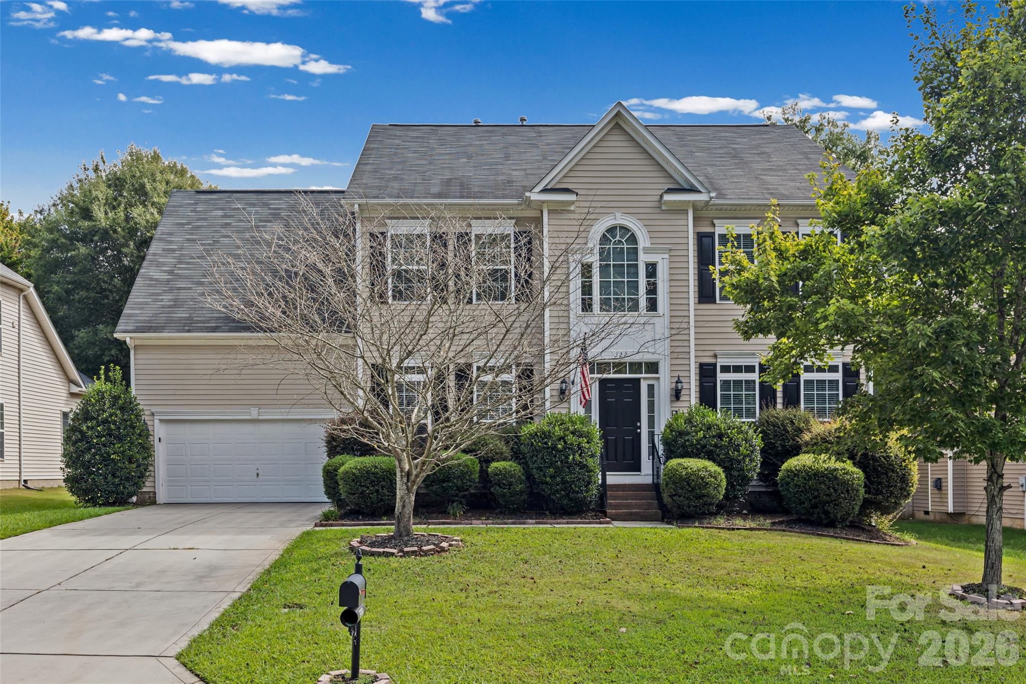 Beautifully spacious and filled with inviting living spaces, 322 Lorraine Road offers 4 bedrooms, 2.5 baths and 3,239 square feet designed for both everyday comfort and entertaining. Rich hardwood flooring flows throughout the main level, where a private study with French doors provides an ideal home office or flex space. The kitchen is open and functional with a large center island, breakfast bar, stainless steel appliances, tile backsplash and generous cabinet and countertop space, all flowing naturally into the breakfast area and family room with fireplace.One of the home's standout spaces is the sunroom, highlighted by an impressive oversized window that fills the room with natural light and creates a beautiful connection to the outdoors. Step outside to an exceptionally spacious, level and fully fenced backyard—a wonderful setting with plenty of room to relax, entertain, play or simply enjoy the open space.Upstairs, the generous primary suite offers a comfortable retreat with ample closet space, complemented by three additional bedrooms and a full bath. With more than 3,200 square feet, generous room sizes, abundant storage and an open, versatile floor plan, this home delivers the space today's buyers are looking for while still feeling warm and welcoming. Conveniently located in Fort Mill with access to I-77, I-485, Charlotte and surrounding destinations.