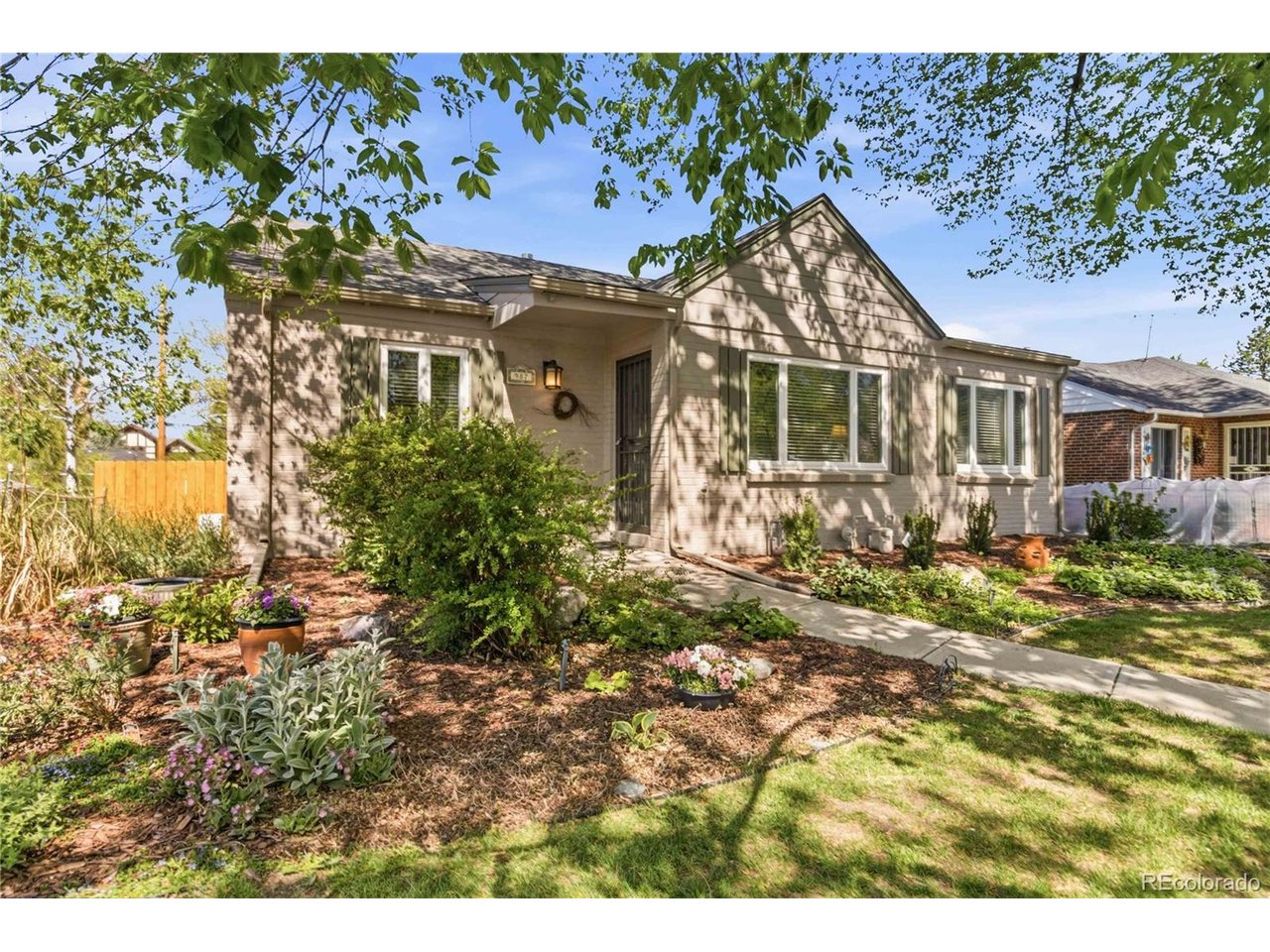 Charming Mid-Century Home in the Heart of Mayfair *** Lovingly owned by the same owner for more than 30 years, this character-filled home presents a rare opportunity in one of Denver's most desirable neighborhoods. Ideally located directly across from Palmer Elementary and just minutes from 9+CO, Cherry Creek, and Downtown Denver, this property combines timeless charm, thoughtful updates, and incredible potential. *** The main level features three bedrooms, one bathroom, and a spacious living room filled with warmth, personality, and classic Mid-Century appeal. The beautifully remodeled kitchen is a standout, showcasing granite countertops, stainless steel appliances, a gas range, and modern finishes that blend seamlessly with the home's original character. A flexible main-floor den can easily be converted back into an additional bedroom if desired. *** The partially finished basement adds even more versatility with a non-conforming bedroom, additional bathroom, and flexible space ready for your vision. Whether you're looking to expand, personalize, or simply enjoy the home as-is, the possibilities are endless.Outside, the meticulously maintained yard creates a peaceful retreat with mature landscaping, sprinkler systems in both the front and back yards, and plenty of room for relaxing or entertaining. Recent updates including a new roof and privacy fence installed in 2025 provide added value and peace of mind. *** This is a wonderful opportunity to own a home with history, charm, and future potential in the heart of Mayfair.
