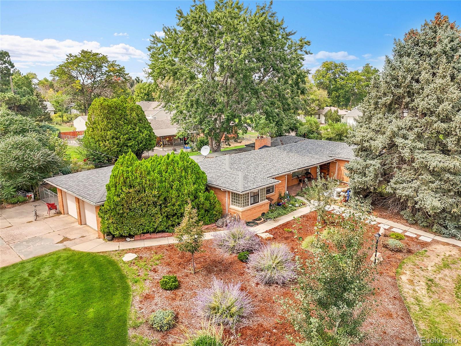 Discover your private oasis in this charming 1948 mid-century modern ranch, nestled on a sprawling 3/4-acre double lot with lush green lawns in the heart of Greeley, CO. This 4-bedroom, 3-bathroom corner-lot gem blends country allure with retro flair, featuring original hardwood floors, glass block windows, and welcoming front and back patios perfect for lively gatherings or serene evenings. The thoughtfully designed layout offers a cozy dining room and kitchen, a spacious living area, three main-level bedrooms, and a finished basement with an additional bedroom and full bath, plus a two-car garage and two mobile air conditioning units for comfort. Brimming with potential for restoration or modern upgrades, this unique home is steps from Northern Colorado Medical Center and UNC, offering the perfect balance of tranquility and connectivity—schedule a tour today to unlock the endless possibilities of this rare find!
Please Note: The Grantor reserves all right, title, and interest in and to all oil, gas, and other minerals in, on, and under the described lands.
