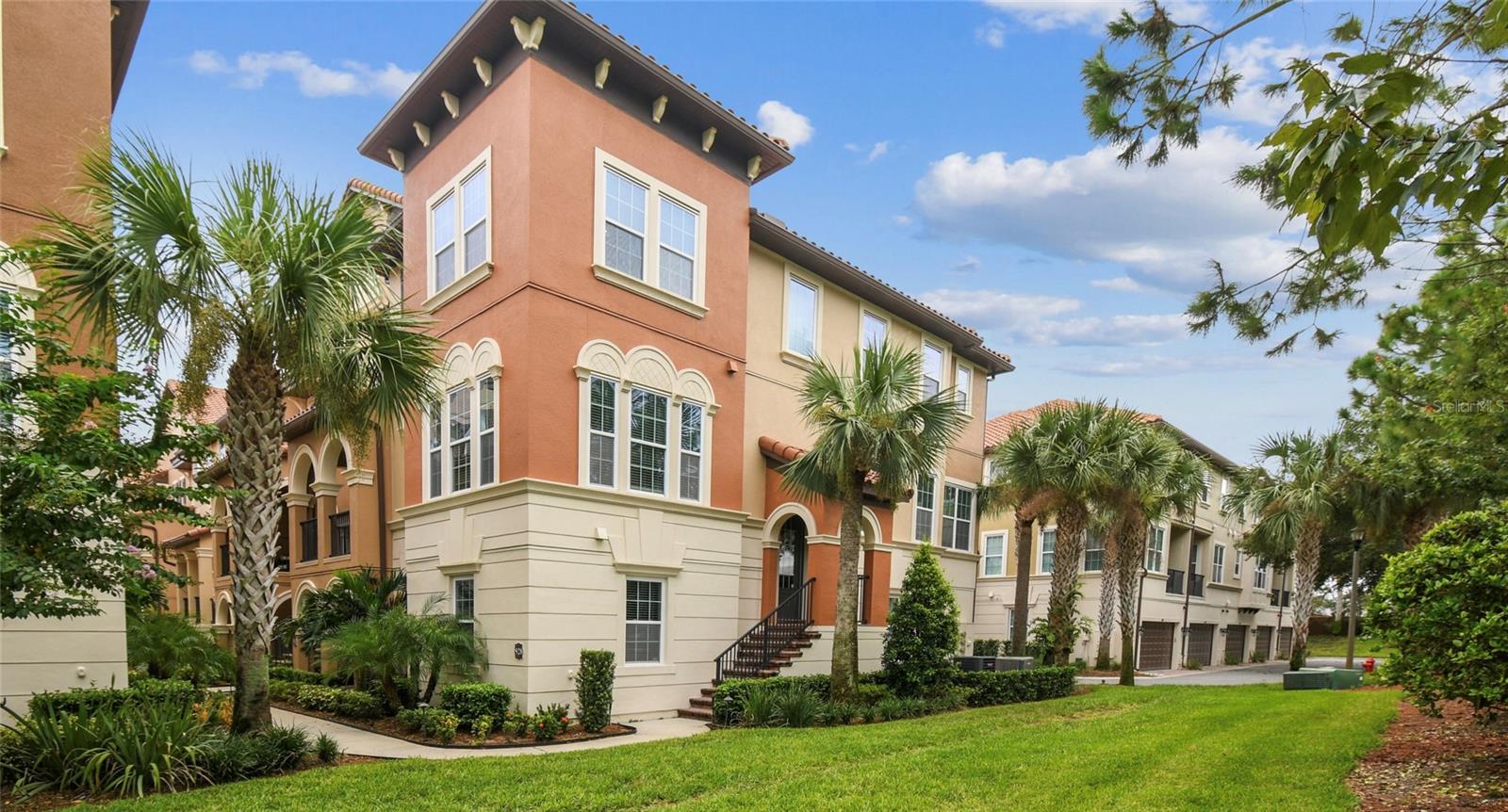 Under contract-accepting backup offers. Beautiful 4-Bedroom, 3.5-Bath End-Unit Torino Model Townhome in the highly sought-after Fountain Parke community! Filled with natural light from multiple windows and soaring ceilings, this home offers an open and inviting layout across three spacious levels.The first floor provides a PRIVATE SUITE option with its own bedroom, walk-in closet, and full bath with walk-in shower—perfect for use as an in-law suite, media room, or private office. Two hallway closets, including one with deep storage, offer excellent organization.The second floor is the heart of the home, where the living room boasts striking WOOD BEAMS that enhance the grand feel of the space. The kitchen features newer stainless steel appliances, TALL cabinets, a stylish backsplash, GRANITE COUNTERS and a large closet pantry. An adjacent dining room makes entertaining easy, while the cozy sunroom/sitting area is perfect for relaxing with a cup of tea. Step out onto the newly SCREENED BALCONY off the kitchen to enjoy warm breezes. A convenient HALF BATH is also located on this level.The third floor hosts the spacious PRIMARY SUITE, featuring an ENSUITE BATH with a walk-in shower, DUAL SINKS with raised vanities, and a CUSTOM WALK-IN CLOSET with built-ins. Two additional bedrooms with cozy carpet share a Jack-and-Jill bath. A versatile loft area, currently used as an office, adds extra living space. For convenience, the laundry closet is also located upstairs and includes a newer washer and dryer.The two-car garage includes OVERHEAD STORAGE RACKS, providing even more usable space. WHOLE HOUSE WATER SOFTENER  ensures clean, soft water for all. Fountain Parke is a 24-hour guard-gated community offering resort-style amenities, including a clubhouse, fitness center, pool, tennis and pickleball courts, playground, and dog park. Conveniently located near Downtown Lake Mary, you’ll have easy access to shopping, dining, grocery stores, and major highways, including I-4 and SR 417.This townhome offers the perfect balance of comfort and convenience in the heart of Lake Mary—schedule your private tour today!