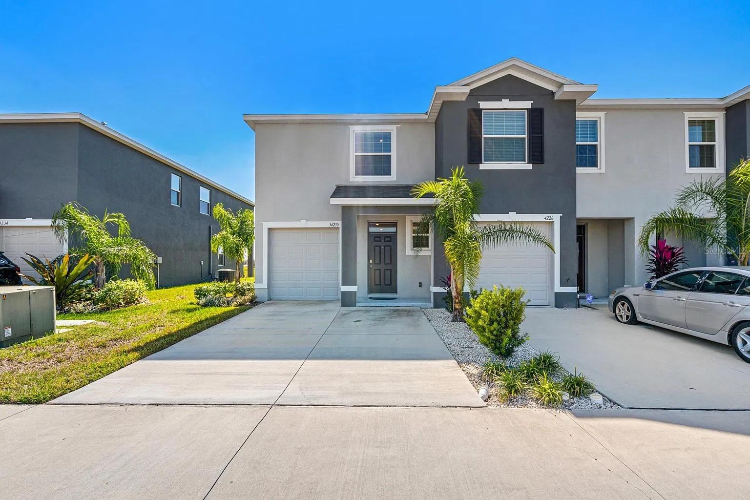 This 3 bedroom, 2.5 bath home offers 1,758 square feet of smart, open living space with all concrete block construction on both floors for strength, quiet, and energy efficiency.Inside you will find an open first floor with extended tile through the main living areas, a kitchen with granite countertops and a full stainless steel appliance package, Connected smart home system. Upstairs, the primary suite features an ensuite bath and generous walk-in closet, with two more bedrooms and a full bath completing the second floor. A one-car garage plus a driveway that fits two more cars means parking is never an issue.Summerstone is an amenity-rich community with a community pool, playground and tot lot, and open recreation areas, and the HOA covers grounds and exterior maintenance so your weekends stay yours. The location is hard to beat: minutes off SR-56, about 5 minutes to Wiregrass Mall and its dining, 15 minutes to I-75, and close to the Tampa Premium Outlets, Main Event Entertainment, and KRATES.