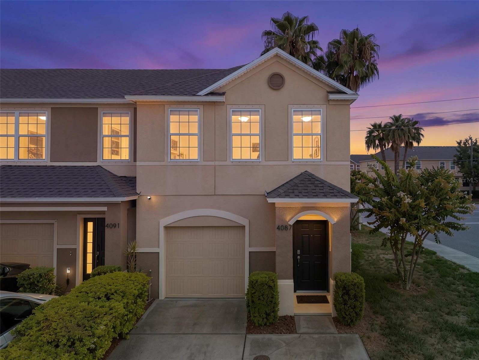 Corner end unit in the Village at Park Place, a well-maintained townhouse community in Pinellas Park. New Roof!  Built in 2015 by Beazer Homes, this 3-bedroom, 2.5-bath home offers 1,500 sq ft with an open first-floor great room, vaulted ceilings, and crown molding throughout the main living area.  The kitchen features espresso wood cabinetry, quartz countertops, a white mosaic tile backsplash, stainless steel appliances, and a center island with seating and a stainless sink. Sliding glass doors lead from the living area to a screened rear patio with a ceiling fan. All three bedrooms are upstairs, along with both full baths and a dedicated laundry room with washer and dryer included. The primary suite includes a walk-in closet, double-sink vanity, and walk-in shower.  As a corner end unit, this home has added windows and natural light, a wider lot footprint, fenced yard, rain gutters, and an attached one-car garage. HOA is $612 per quarter and covers exterior building maintenance, grounds care, irrigation, and management.  Minutes to The Shoppes at Park Place, with dining, a movie theater, and retail just steps away.
