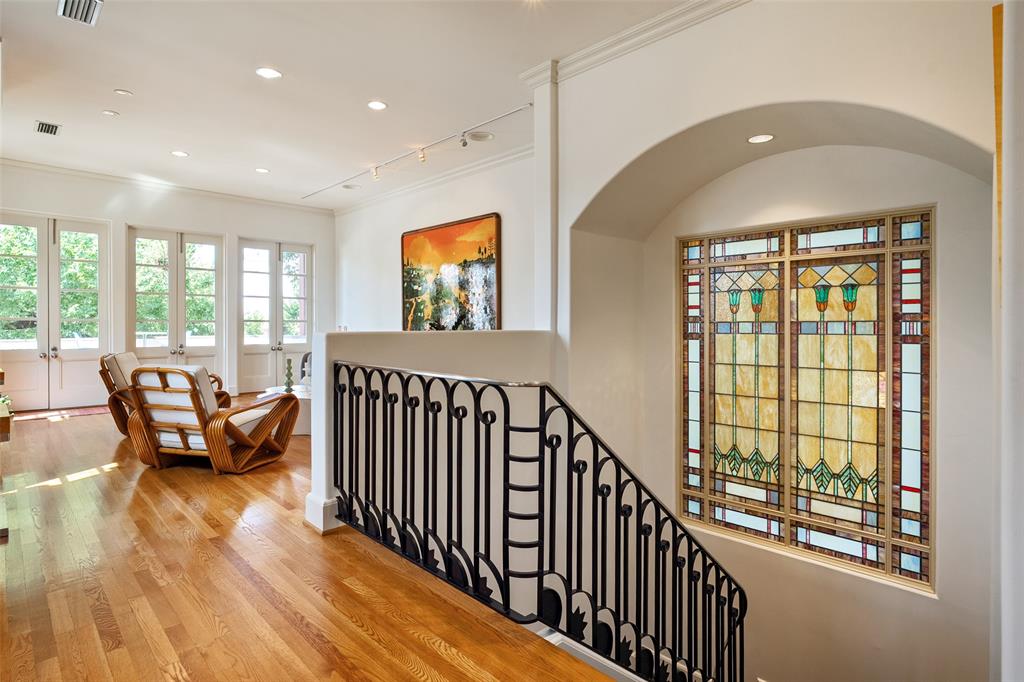 Spectacular single family home known as The Art House on Allen. Designed by noted Dallas architect Jack C. Irwin as his personal home, this property features a timeless California Modern Mission design that seamlessly blends indoor living with the outdoors. This urban private oasis is further enhanced by a recently added luxury pool, spa, and water feature. Situated in the desirable State Thomas neighborhood with downtown views, the home is within walking distance of local restaurants, grocery stores, retail shops, Griggs Park, and Klyde Warren Park, while offering convenient highway access. The residence is thoughtfully laid out across four floors, all of which are easily accessible via the home's four stop elevator. On the first floor, you will find a large third bedroom with a fireplace that could also serve as separate quarters, complete with its own kitchen and ensuite bath. The second floor features a spacious primary suite with a private lanai and a spa-style bathroom equipped with dual sinks, a spa tub, separate shower, and two walk-in closets. This level also includes a second bedroom that can function as an office with custom bookshelves. The third floor houses the main kitchen, living, and dining area, along with another lanai to enjoy the outdoor views. Finally, the fourth floor contains a finished room currently functioning as a home gym.