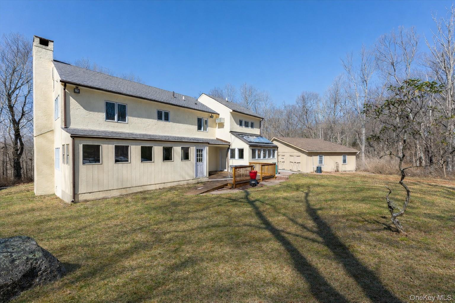 This private and spacious home sits on 2.5 acres of beautiful land in Pound Ridge, and is the ideal Westchester retreat. It has that perfect mix of "peace and quiet" without being completely off the grid. With 4 bedrooms and 3 full bathrooms, you’ll have plenty of room for everyone. The versatile floor plan offers endless possibilities to make the space your own. Enjoy a bright eat-in kitchen with skylights that fill the room with natural light—perfect for morning coffee. The large quartz-topped island is perfect for meal prep and entertaining, and features a gas cooktop. A wood-burning stove in the den is cozy and warm on cold nights. Large windows throughout the home create a light and airy atmosphere. This home features an elegant formal dining room—perfect for hosting holiday feasts and candlelit dinner parties. The living room centers around a classic fireplace, offering a warm, relaxing retreat for evenings at home. An unfinished space just off the living room offers exciting potential. Createa sunroom, screened-in porch, home office, or additional living area tailored to your vision. The newly built two-car garage (2022) provides ample storage. New roof in 2025. Whirlpool dishwasher 2021, Stove top on Island 2023, Oven and in-wall microwave 2020/2021. GE Refrigerator 2023. Taxes will have substantial reduction.