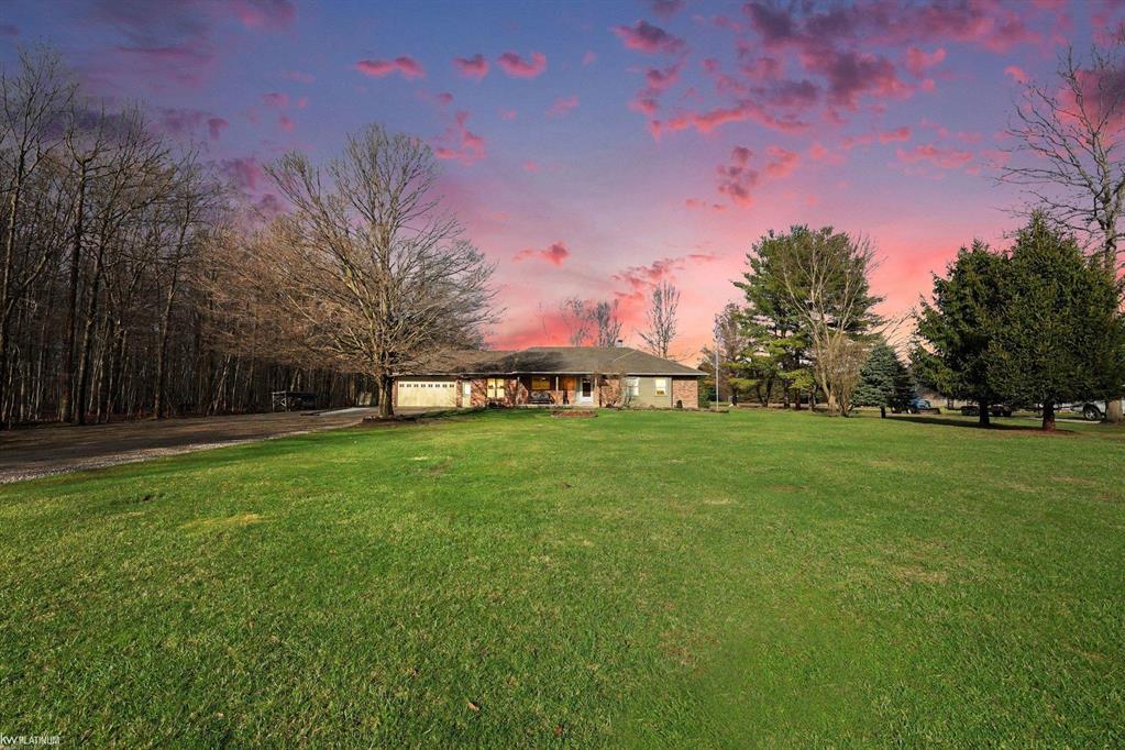 Nestled on over 5 acres, this well-maintained 1,700 sq ft brick ranch offers the perfect blend of comfort, space, and functionality. Built in 1992, the home features 3 bedrooms, a dedicated office, convenient first-floor laundry, and a bright four-seasons sunroom-ideal for enjoying peaceful views year-round. The property truly shines outdoors with a beautifully cared-for pond equipped with an Airmax Ecosystem aeration system, creating a serene and inviting setting. Need space for hobbies, storage, or a workshop? The impressive pole barn offers nearly 1,000 sq ft of storage plus an additional 480 sq ft heated workshop (pellet stove), along with an extra shed for even more flexibility. Inside, you'll appreciate thoughtful updates including Pella windows (2020), granite countertops (2021), newer carpet, hot water tank, and major exterior improvements such as a new barn roof (2025) and chimney sweep (2025). A whole-house reverse osmosis filtration system adds even more value and peace of mind. The full basement is ready for your finishing touches-with a pool table included to get you started! If you've been looking for privacy, space, and a move-in ready home with room to grow-this is it. Immediate occupancy at closing.