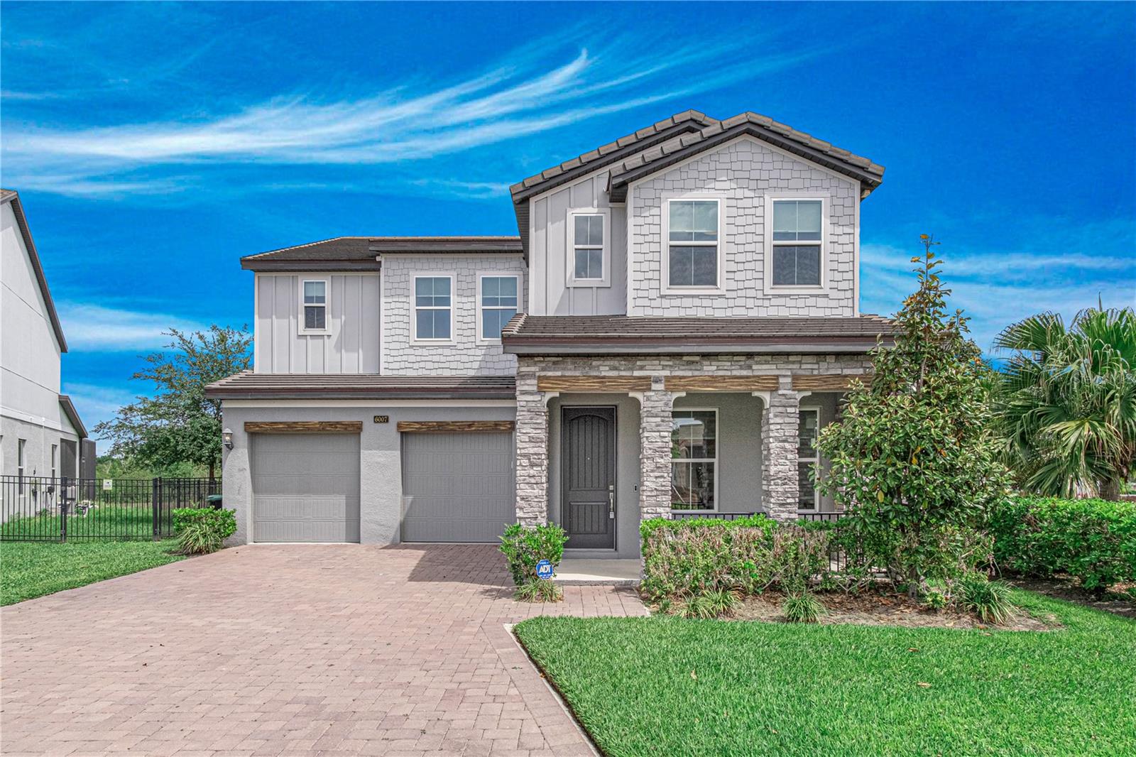 Location Location Location ! only 4 years old Lake front house in gated community, come to build your owe boat deck! A very impressive home with many desirable features. 10 feet high celling at first floor and all house 8 feet doors make this luxurious property, Downstair has FUL bath and bedroom, ALL bedroom with walk-in closet! perfect for family who enjoy entertaining guests. The 5 bedrooms and 4.5 full baths provide ample space for everyone, while the upgrades and energy-efficient features make the home both functional and eco-friendly. Having 36 feet of frontage on Little Sand Lake for a private boat dock is a great bonus, and being directly across the street from the community pool and parkprovides additional recreational opportunities. The upgraded kitchen with its brand new KitchenAid appliances,quartz countertops, spacious walk-in pantry, and butler's pantry with wine cooler will surely please any gourmetcook. The Master Bedroom with its lounge/workout area, private balcony, and lake view is a luxurious retreat. Thelarge walk-in closet and tub and shower in the Master bathroom add to the overall appeal. Custom made the blinds,  back screen room and fence Being located in one of the few gated communities in the heart of Dr. Phillips, and only minutes away from major roads, shopping, restaurants Row, Great schools, and theme parks, makes this home a great option for those seeking both luxury and convenience.