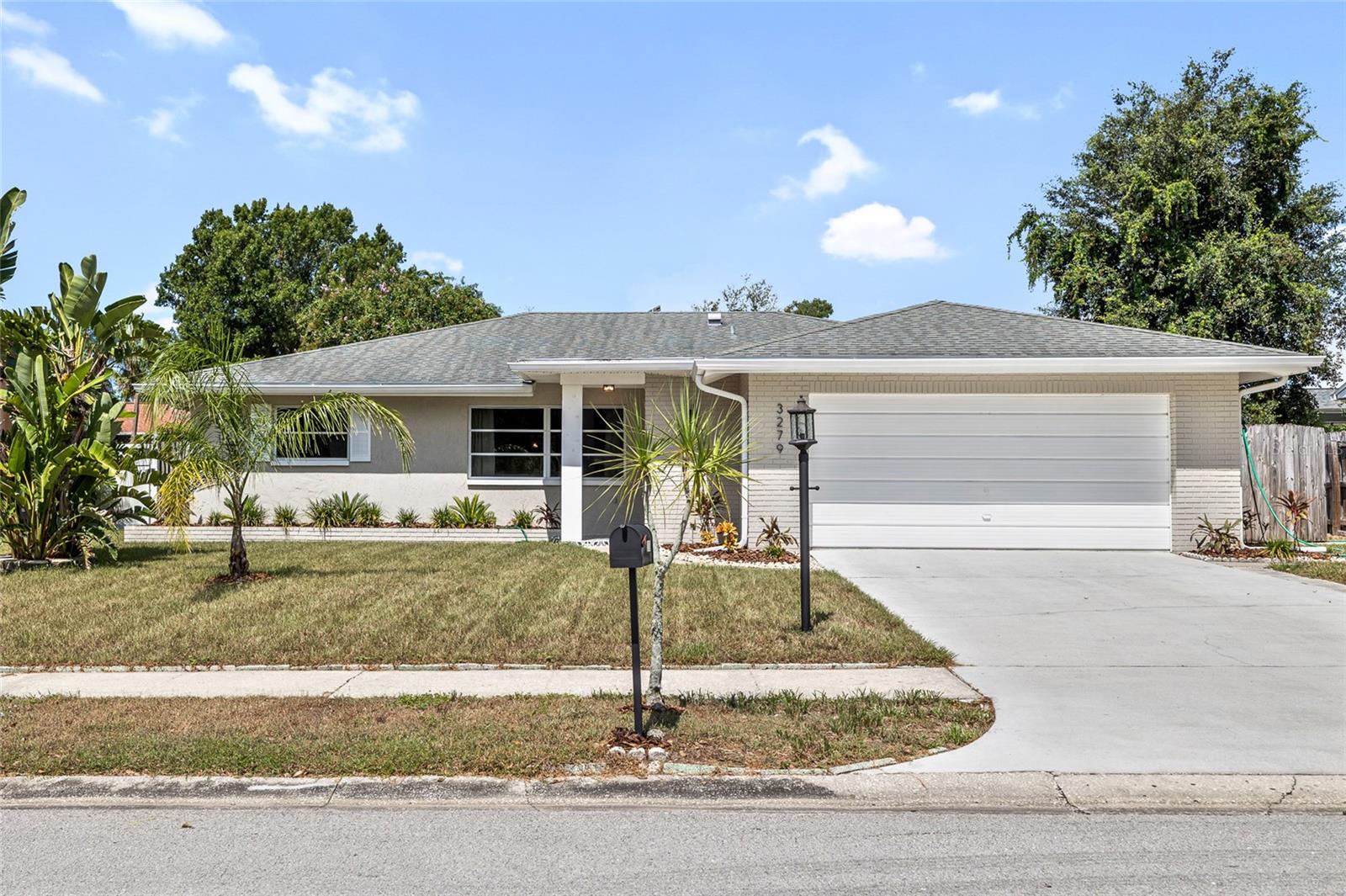 Tucked into a quiet Palm Harbor neighborhood, this stylishly updated home offers comfort, character, and a taste of Florida living. With 3 bedrooms, 2 bathrooms, and 1,616 square feet, the interior features luxury vinyl plank flooring in the main living areas and primary bedroom, while the secondary bedrooms are finished with plush carpet for added coziness. The kitchen is both functional and inviting, with ample counter space, generous cabinetry, and Frigidaire appliances.

Step outside to your own backyard oasis, complete with mature mango and avocado trees — perfect for enjoying morning coffee or gathering with friends. 

Close to top-rated schools, charming downtown Palm Harbor, parks, shopping, and the area’s world-renowned beaches, this home is a true gem in one of Tampa Bay’s most desirable communities.