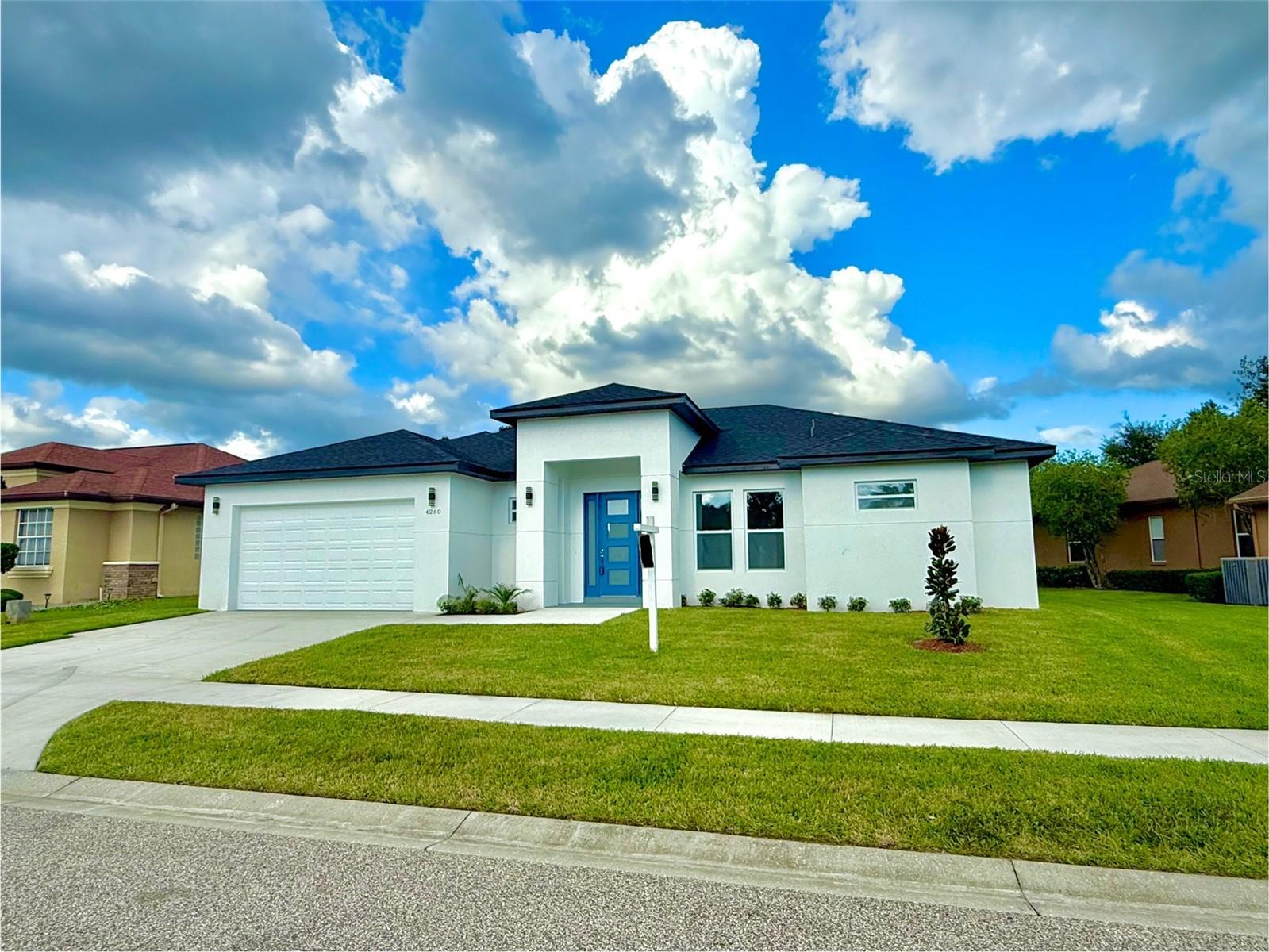 Welcome to this exquisite modern new construction home nestled within the beautiful gated community of Hernando Oaks. From the moment you step inside, you’re greeted by soaring ceilings, 8-foot doors, and a bright open-concept layout. The chef’s kitchen features 42” cabinets, quartz countertops, generous prep space, and an 8-foot island—ideal for both entertaining and everyday living. The home has a split floor plan offering privacy for the master suite. The master suite spans the entire right side of the home and offers a tray ceiling, oversized walk-in closet, and a spa-inspired bathroom with a free-standing tub, walk-in shower, and dual vanity. Thoughtful upgrades throughout include impact-resistant windows and sliders, CAT6 connections, laundry sink in laundry room, irrigation system, 5” baseboards, and wall TV prewiring in all bedrooms and the Florida room. Enjoy peaceful Florida weather from your covered lanai, or step out and explore the community’s 18-hole golf course, complete with pickleball court, and regular community events. Hernando Oaks Community offers a lifestyle of comfort, recreation, and convenience—just minutes from shopping, dining, and essential services. This isn’t just a home—it’s a lifestyle. Call and schedule your private showing!