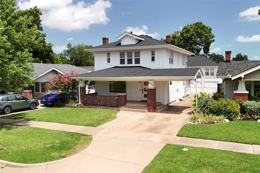 Refined Historic Charm with Modern Updates + Bonus Garage Apartment! This Gatewood Historic District home has been thoughtfully renovated to combine contemporary luxuries with timeless character. A broad front porch with brick columns welcomes you into a light-filled interior where original hardwoods and crisp white walls create a clean, versatile backdrop. The living room centers around a custom wood-and-shiplap electric fireplace feature wall, flanked by floating shelves for a perfect blend of warmth and style. Flowing seamlessly into the kitchen, you'll find modern shaker cabinetry with glass fronts, Samsung Black Stainless Steel appliances, cabinet lighting, quartz countertops, marble tile backsplash, a farmhouse sink, a walk-in pantry, and a large island with bar seating—ideal for everyday living or entertaining. Tucked off the dining area—complete with exposed brick and a dry bar—is a stylish powder bath, a well-planned mudroom/laundry space, and backyard access. Upstairs, the spacious primary suite offers a serene retreat with a walk-in closet, double vanity, and spa-inspired shower, while two additional bedrooms share a hall bath and retain their classic charm. Out back, a private drive leads to a rare three-bay carriage garage topped by a 600-square-foot guest apartment (not included in main square footage). Complete with its own kitchen, living area, bedroom, and bath, this flexible space is perfect for guests, older children, work-from-home, or rental income. Additional updates include a new roof installed in June 2025, ensuring peace of mind for years to come. Centrally located in Gatewood and just steps from the Plaza District and minutes to Uptown 23rd, Midtown, and Downtown, this home offers the perfect blend of history, style, and convenience. Schedule your showing today!
