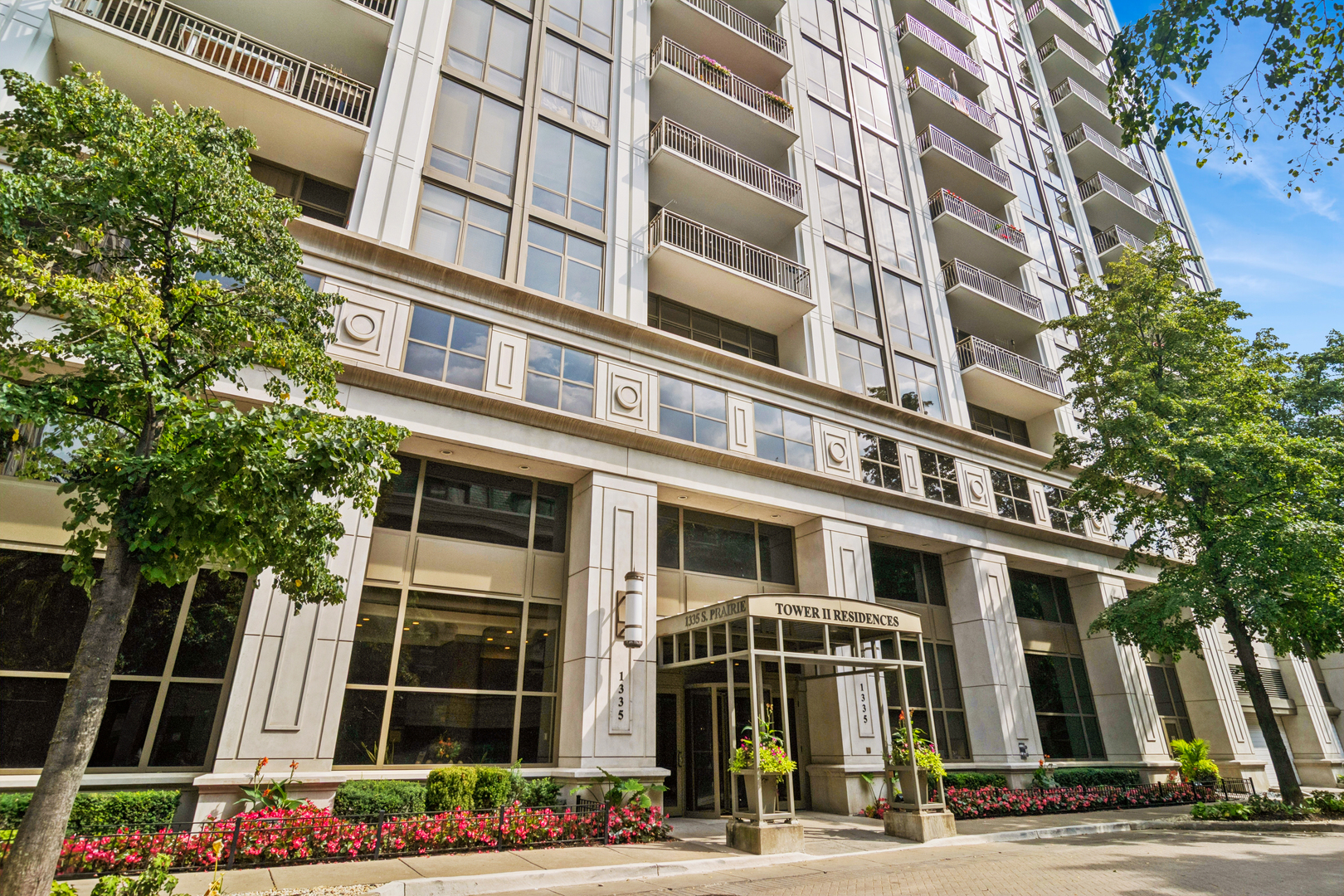 Welcome home to this perfect combination of size, layout and views! Your foyer entrance feels grand with thoughtfully detailed tray ceilings plus an entire wall of closets on one side and plenty of wall space on the other for an amazing art display. The open and sunlit vistas from your South West corner floor to ceiling windows plus your 2 oversized private balconies offer several stunning vantage points to choose from for places to sit and enjoy the surroundings. This customized floorplan offers something for everyone with hardwood floors throughout, motorized window treatments in most rooms, a split bedroom floorplan, additional powder room for maximum convenience, plus a versatile 3rd bedroom with French doors & access to the balcony that sits graciously overlooking Webster Park. Spacious living and dining room create a warm and inviting space perfectly perched over the tree tops and the Lakefront with dramatic floor to ceiling windows. The maple & granite kitchen has a double oven, full pantry and easy access to a well placed balcony overlooking Soldier Field and the Lake. The primary suite is nicely tucked away as its own retreat with spacious room size, access to private balcony, custom built in desk & walk in closet; all marble bath with soaking tub, stand up shower with body sprays & handheld, water closet & double Euro height vanity. Enjoy all the South Loop has to offer including all the neighborhood conveniences such as restaurants, shops, public transportation, access to the Lakefront, Museums, Grant Park and more. This full amenity building includes 24 hr doorstaff, penthouse exercise room, clubroom with billiard tables and more AND outdoor pool and sundeck! Heated tandem garage parking additional 55K. Additional single garage spot in neighboring building available for 35K