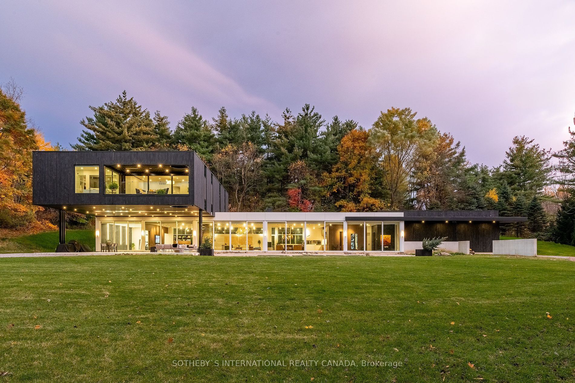 Welcome to your Award winning dream home, nestled on a private 5 acre estate surrounded by Conservartion. Crafted by DB Custom Homes & masterfully envisioned by SMPL Design, this net-zero inspired masterpiece spans over 8019 sq ft & draws on the iconic style of Mies van der Rohe, offering a seamless blend of modern elegance & natural beauty. Encased in glass, sleek white ACM panels, rich wood siding & green roof, top tier quality is evident throughout this home, including the little details. Enter into an abundance of natural light and space with soaring 11.5 ft ceilings and 12 ft custom sliding glass doors spanning 115 ft across, allowing the tranquil landscape to seamlessly integrate with your living space. This harmonious flow creates a luxurious yet inviting ambiance perfect for intimate gatherings or grand celebrations.The gourmet kitchen is a culinary enthusiasts dream, offering premium integrated appliances & 17 ft working island. The first level offers something for everyone: 2 cozy living spaces, home gym with sauna, office, dining, walk-in pantry & a versatile 1200 sq ft studio. Retreat to the luxurious primary suite, complete with a spa-like ensuite & private terrace where you can unwind & take in peaceful views of the lush landscape. Adding to the homes versatility, lovingly updated 2200 sq ft 2-storey detached structure w/ 2 garage doors offers endless possibilities. Private trails & spring-fed pond invite you to explore the perfect escape into nature with easy access to all amenities. This ultra-efficient multiple award-winning smart home entails:* almost ZERO heating/cooling costs = Solar, geothermal system/in floor heating both levels/HVAC/, 9-species maintenance-free live roof, optimal level of insulation throughout * Average $50/month Solar Power Energy * triple-pane 12 foot custom sliding doors * Tarion Warranty * Smart home technology * Back-up generator * Detached 2,200 sqft building * Approved pool permits * Extended list of features attached.