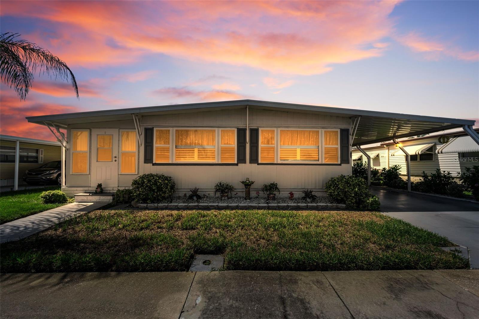 MOVE-IN READY 3-BEDROOM, 2-BATH HOME IN HIGHLY DESIRABLE TARPON SHORES 55+ COMMUNITY! Offering 1,150 HEATED SQ. FT., this beautifully maintained home delivers the SPACE, UPDATES, and LOW-MAINTENANCE FLORIDA LIFESTYLE you've been looking for! BEST OF ALL, THE $40,000 CO-OP OWNERSHIP SHARE (LAND INTEREST) IS INCLUDED IN THE LIST PRICE — NOT AN ADDITIONAL COST! The share may also be financed through Tarpon Shores MHP, subject to applicable terms and approval.Step inside to a LARGE, INVITING LIVING ROOM and spacious FLORIDA ROOM with a WALL-MOUNTED A/C UNIT ADDED IN 2024 for added year-round comfort. THREE GENEROUSLY SIZED BEDROOMS offer plenty of room for guests, a home office, or hobbies. The Primary Bedroom features a BEAUTIFULLY UPDATED EN-SUITE BATH with a BRAND-NEW SHOWER, PRIVATE WATER CLOSET, and a BEAUTIFUL BARN DOOR ADDED IN 2024 FOR ADDITIONAL PRIVACY. The Guest Bath also features a convenient STEP-IN SHOWER. The Kitchen includes ALL APPLIANCES, with HIGH-QUALITY LAMINATE AND TILE FLOORING throughout — AND THE FLOORS ARE SOLID! An OVERSIZED 12' x 8' SHED houses the Washer & Dryer and provides excellent additional storage.BIG-TICKET UPDATES ARE ALREADY DONE: NEW ROOF (2024), NEW PACKAGE UNIT A/C & HEAT SYSTEM (5/2024), ALL NEW DUCTWORK (2024), EXTERIOR PAINT (2024), UPDATED PRIMARY BATH WITH BRAND-NEW SHOWER, DOUBLE-PANE INSULATED WINDOWS (2012), and VAPOR BARRIER (2010), plus a painted carport and WIDENED DRIVEWAY. Even better — NOT IN A FLOOD HAZARD ZONE!Tarpon Shores is a popular RESIDENT-OWNED 55+ COMMUNITY offering a LARGE HEATED POOL, CLUBHOUSE, PICKLEBALL, bocce ball, shuffleboard, billiards, BBQ area, library, and organized activities. The LOW $326 MONTHLY FEE includes LAWN CARE, LAWN SPRAYING, WATER, SEWER, TRASH, CABLE TV, INTERNET, and the COMMUNITY INFORMATION CHANNEL.LOCATION, LOCATION, LOCATION! Enjoy the WORLD-FAMOUS TARPON SPRINGS SPONGE DOCKS, beaches, parks, boating, fishing, golf, shopping, dining, and beautiful Florida sunsets — all nearby. 3 BEDROOMS • 1,150 HEATED SQ. FT. • 2024 ROOF • 2024 A/C & HEAT • NEW DUCTWORK • UPDATED PRIMARY BATH • $40,000 OWNERSHIP SHARE INCLUDED • LOW $326 MONTHLY FEE • LOW TAXES • NO FLOOD HAZARD ZONE! This one checks the boxes — SCHEDULE YOUR PRIVATE SHOWING TODAY!