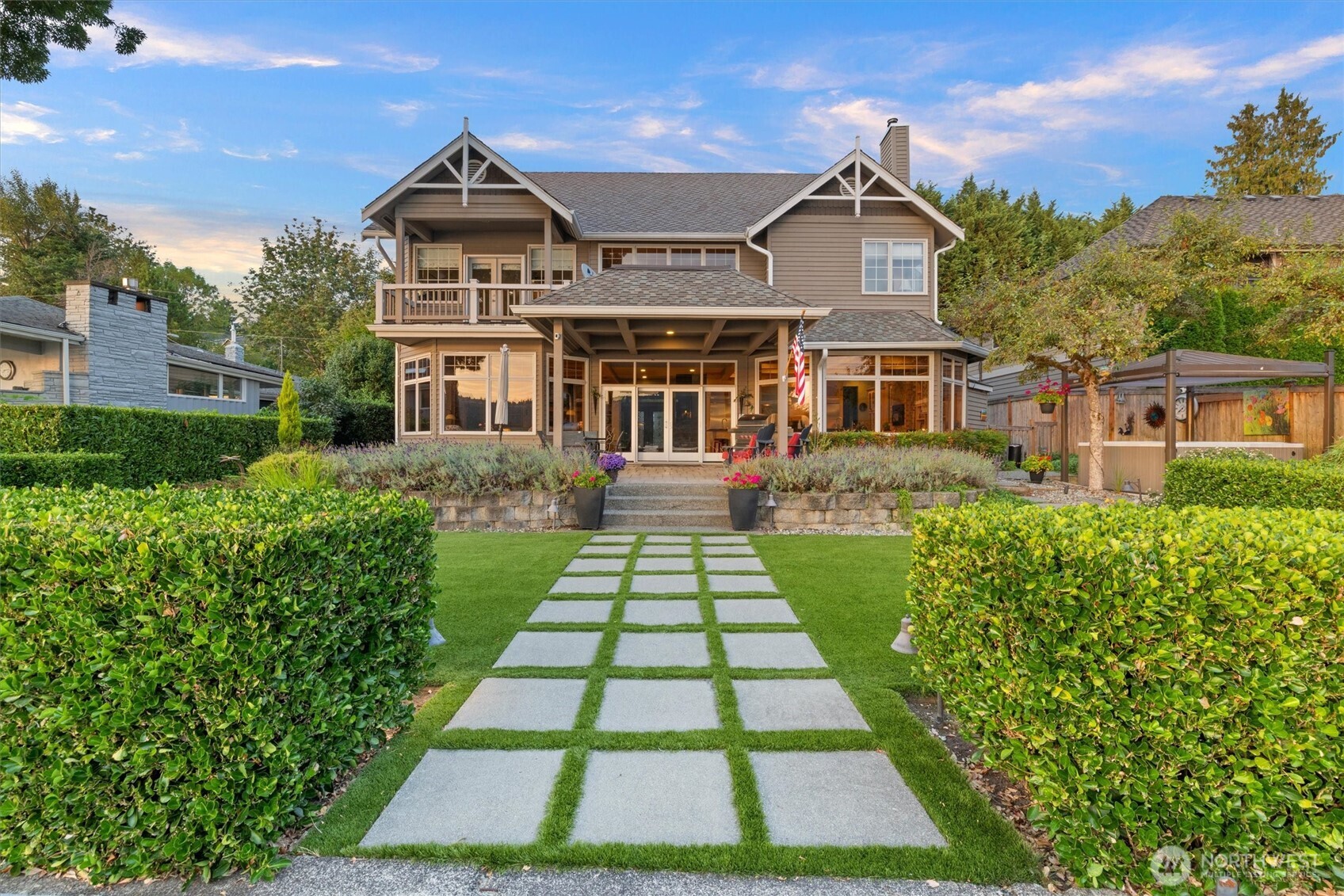 Wake up to shimmering lake views, sip coffee on the deck and spend summer afternoons boating from your private dock. Evenings invite gatherings on the back patio as the sun sets over Lake Sammamish. Inside, a chef's kitchen with Sub-zero and Wolf appliances makes entertaining effortless while the spa-like primary suite offers a serene retreat. Offering rare privacy yet only minutes to Redmond and Issaquah, this home blends luxury and convenience in a rare waterfront retreat!