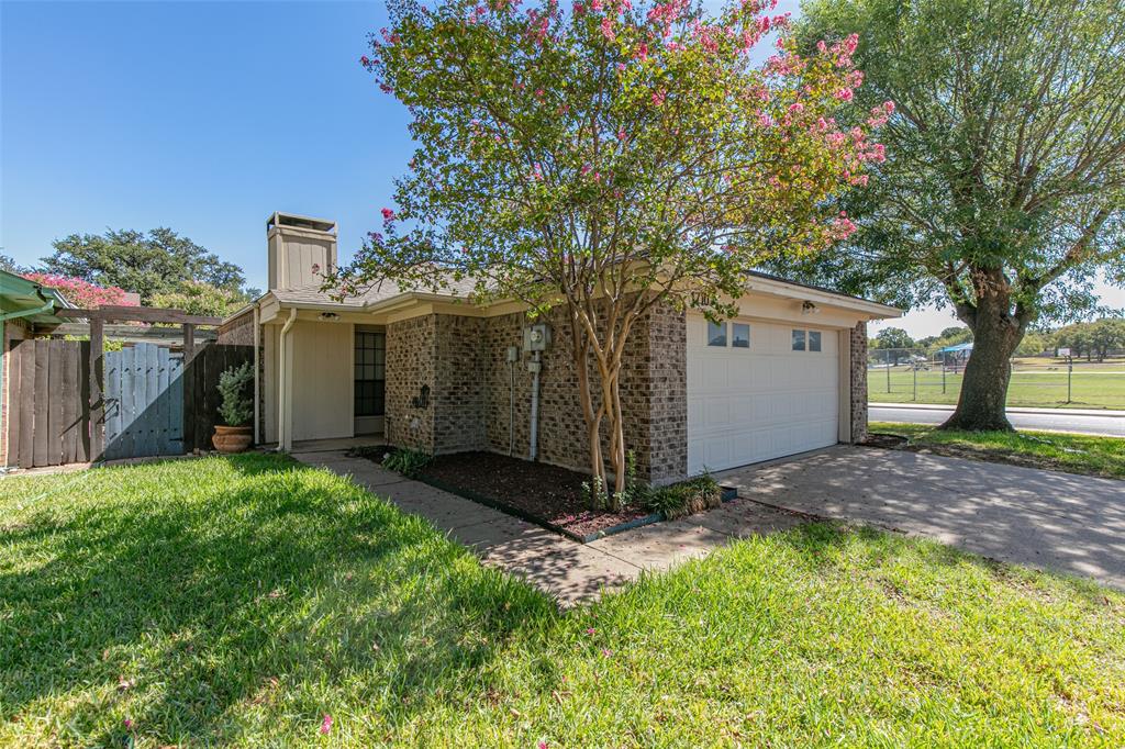 Set across from Lakewood Elementary, this three-bedroom, two-bath Euless home offers a fenced backyard and an attached two-car garage. Laminate and tile flooring throughout make everyday upkeep simple, while stainless steel appliances complement the kitchen. Three bedrooms provide flexibility for sleeping space, guests, or a home office. The backyard offers space for outdoor seating and gardening, with garage parking and storage rounding out the home’s practical features.