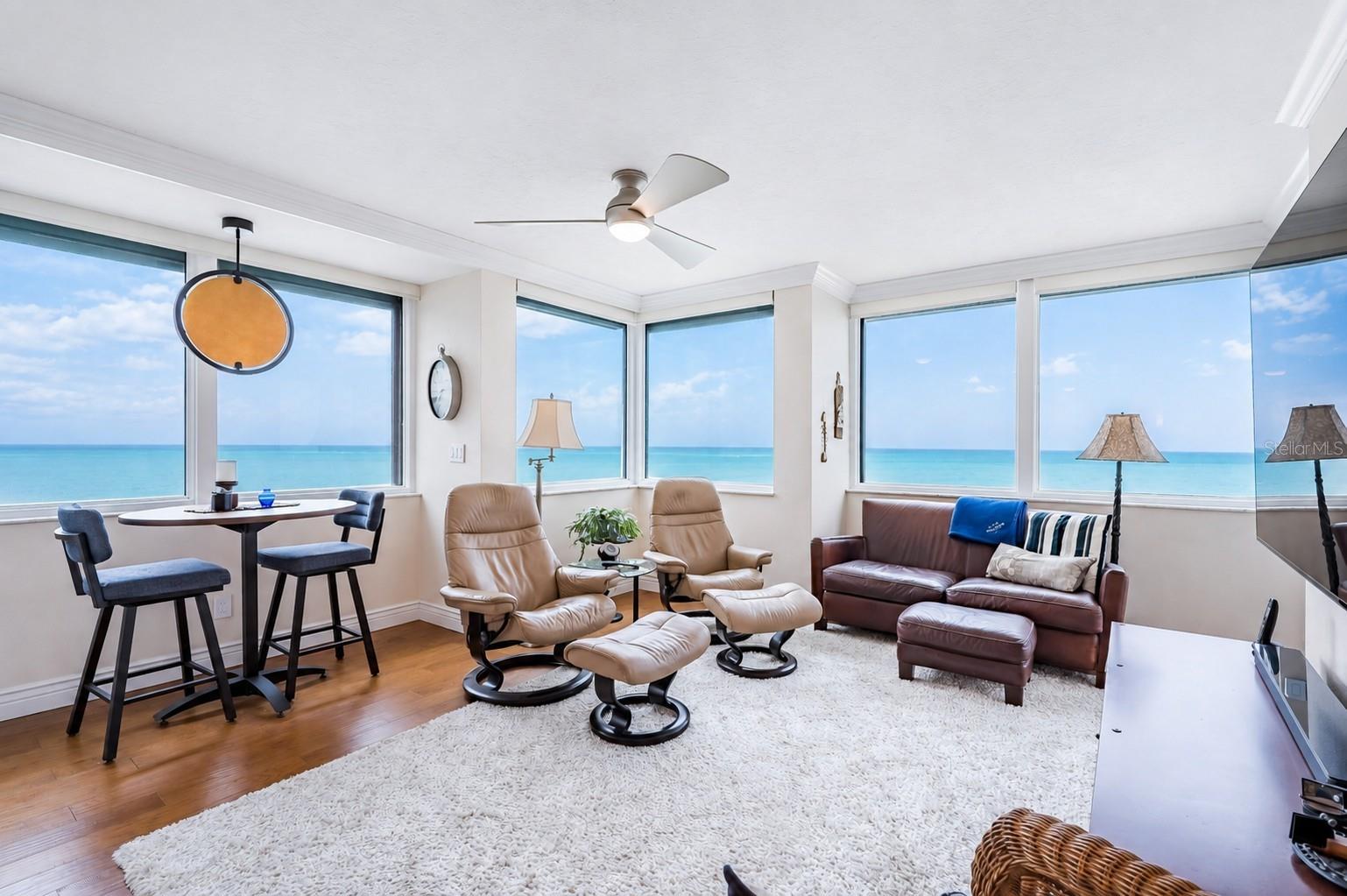 REMODELED BEACHFRONT RESIDENCE! Experience the very best of Clearwater Beach from Dan’s Island, an established Gulf-front community offering exceptional views, generous residences, and an enviable beachfront lifestyle. This beautifully updated 2-bedroom, 2-bath residence encompasses approximately 1,880 square feet and is distinguished by sweeping Gulf of Mexico views and an extraordinary wraparound balcony of approximately 900 square feet—creating an expansive extension of the living space and a front-row setting for Clearwater’s spectacular sunsets.Inside, the residence feels open, sophisticated, and remarkably spacious. One of the larger floor plans in the community, it features a gracious great room with wood flooring, an electric fireplace, and new sliding glass doors that frame the Gulf and open seamlessly to the balcony. The scale of the outdoor space is particularly impressive, with ample room for multiple seating and entertaining areas surrounded by water views.The kitchen is well appointed with custom wood cabinetry, solid-surface countertops, and stainless-steel appliances, while the desirable split-bedroom configuration provides privacy for owners and guests alike. Both the primary suite and guest suite enjoy beautiful Gulf views and direct balcony access, allowing the waterfront setting to remain an integral part of nearly every room. Updated bathrooms feature custom cabinetry and frameless glass shower enclosures for a clean, refined finish.Dan’s Island offers the amenities expected of a true beachfront community, including a 24-hour manned guardhouse, Gulf-front social room, fitness center overlooking the water, racquetball and basketball courts, and a heated pool and spa just steps from the beach. For boating enthusiasts, privately owned boat slips are located directly across the street and may occasionally become available for purchase or lease.Ideally positioned on Clearwater Beach with convenient access to restaurants, shopping, boating, and recreation, the residence is also within easy reach of both St. Pete-Clearwater International Airport and Tampa International Airport. A rare combination of substantial interior space, exceptional outdoor living, direct beach access, and panoramic Gulf views—this is Florida waterfront living at its finest.