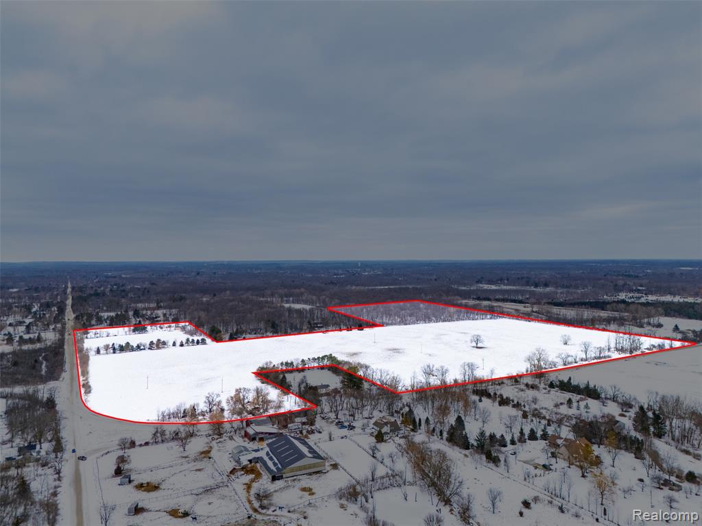 What would you do with 71 Acres? Ideally positioned in Salem Township with South Lyon mailing and South Lyon Schools? Agricultural Zoning with so many possibilities that go beyond cultivating crops. Imagine being Salem's premier wedding venue, with a pergola, bonfire area with large paver patio for celebrating or a beautiful barn to host other events and retreats. Well suited to be a vineyard or to grow hops to aid in Michigan's quickly growing microbrewery industry, the space could accommodate multiple ventures. Pursuing landscaping or greenhouse operations? This parcel offers all of the space you need for the horticultural endeavors you have been waiting to pursue. The opportunities don't stop there: an equestrian ranch with horse boarding or a commercial riding stable, a veterinary clinic or animal hospital with space for animals to recuperate; a tree farm for seasonal success, a corn maze or cider mill for recreational entertainment. An idyllic location for a charming bed and breakfast with on site activities, rural surroundings for rest and a quick drive to Ann Arbor or Northville for play. Maybe the best part? This parcel includes a 4 acre building envelope if you are looking for the peace and seclusion to customize your single family dream home surrounded by untouched land. This parcel is in a conservancy so you can rest assured your vision is not interrupted by development plans. It extends across the street to a 6 acre area northwest of the property and a ten acre heavily wooded area northeast of the main property, guaranteeing you are surrounded by the views and privacy you have dreamt of. Peace, seclusion, abundant business opportunities and, of course, fantastic farm land. Bring your vision and claim the potential. This land is ready for you.