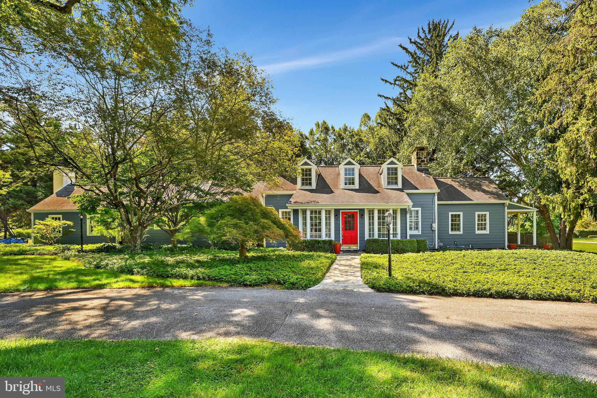 Welcome to a truly one-of-a-kind home where timeless Old World charm meets modern comfort, beautifully  situated on a picturesque 1 acre corner lot.  The circular driveway creates an inviting approach. Enter into a sunny enclosed porch with flagstone flooring & 3 walls of windows. Step into the charming living room with beamed ceiling & expansive fireplace along with hardwood flooring throughout the 1st level. The Dining room also has a large fireplace with French doors to the outside.  The updated eat-in Kitchen is thoughtfully designed for everyday living. Step up to a spacious family room with stone fireplace providing an inviting gathering space.  The first floor offers the primary bedroom with a walk-in closet, a stunning full bath, soaking tub, double vanity & stall shower plus washer/dryer.  There is a second full bath which leads into another bedroom with access to a covered porch. A nice size hallway with bookshelves leads upstairs to an oversized bedroom/flex room with its own full bath plus 2 nice closets. This space offers tremendous flexibility as a private retreat, home office, guest suite, studio or additional living space.  The Dining Room & Kitchen open to a large flagstone patio with a charming water fountain/ pond, creating a seamless transition to the outdoor spaces to enjoy the beauty and privacy of this exceptional property.  Recently added, an amazing heated and cooled workshop provides even more possibilities whether used as a workshop, studio or a fabulous home gym, this is versatile bonus spaces sure to impress.An additional driveway leads to a detached 2 car garage with second-story storage plus more parking.  Ideally located with convenient access to major highways and extensive shopping, this remarkable property offers the perfect balance of privacy and accessibility.  Rich in character, thoughtfully updated and filled with unique amenities, this truly is a special home that must be seen to be appreciated - a rare and truly one of a kind opportunity!