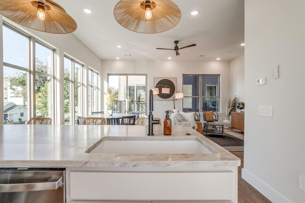 ** OFFERING 1 MONTH FREE WITH MOVE IN PRIOR TO 5-1-25! ** Experience the pinnacle of modern design & urban sophistication at Linwood Quarter, a boutique townhome community perfectly situated in one of FW’s most walkable & vibrant neighborhoods. Thoughtfully designed and built, each residence at Linwood Quarter delivers a rare balance of style, functionality & location - without compromise. Linwood Quarter offers three stunning design packages - The Terra, The Noir & The Lumen - each inspired by a distinct aesthetic and lifestyle. This unit features The Noir, emphasizing Moody Organic design: rich wood tones, dramatic stone surfaces, & dark, evocative accents that create a bold yet welcoming atmosphere. Every inch of this home is crafted with intention, blending luxury and practicality for an effortlessly elevated living experience. Inside, the curated interiors reveal custom cabinetry, natural stone countertops in exquisite quartzite and leathered granite, and real hardwood floors. High-end Delta plumbing fixtures & stainless steel GE appliances - including GAS ranges -offer both form & function, while the Energy Star efficiency rating and spray foam insulation ensure year-round comfort and performance. Expansive 10-foot ceilings on the main level! The primary suite offers the walk in shower of your dreams, dual vanity and walk-in closet. LOTS of storage! Bonus built in desk workspace. The oversized garage easily accommodates SUVs, bikes & extra gear. Upstairs, the private rooftop terrace invites you to unwind or entertain against the backdrop of panoramic downtown Fort Worth views.Linwood Quarter is steps from Linwood Park, walking distance to the new $1.7B Westside Village & UNT Health Science Center, & just three miles from TCU & TAMU Law School. Here, refined design meets unmatched location - creating an urban sanctuary where luxury feels effortless & every detail reflects your sense of style.
